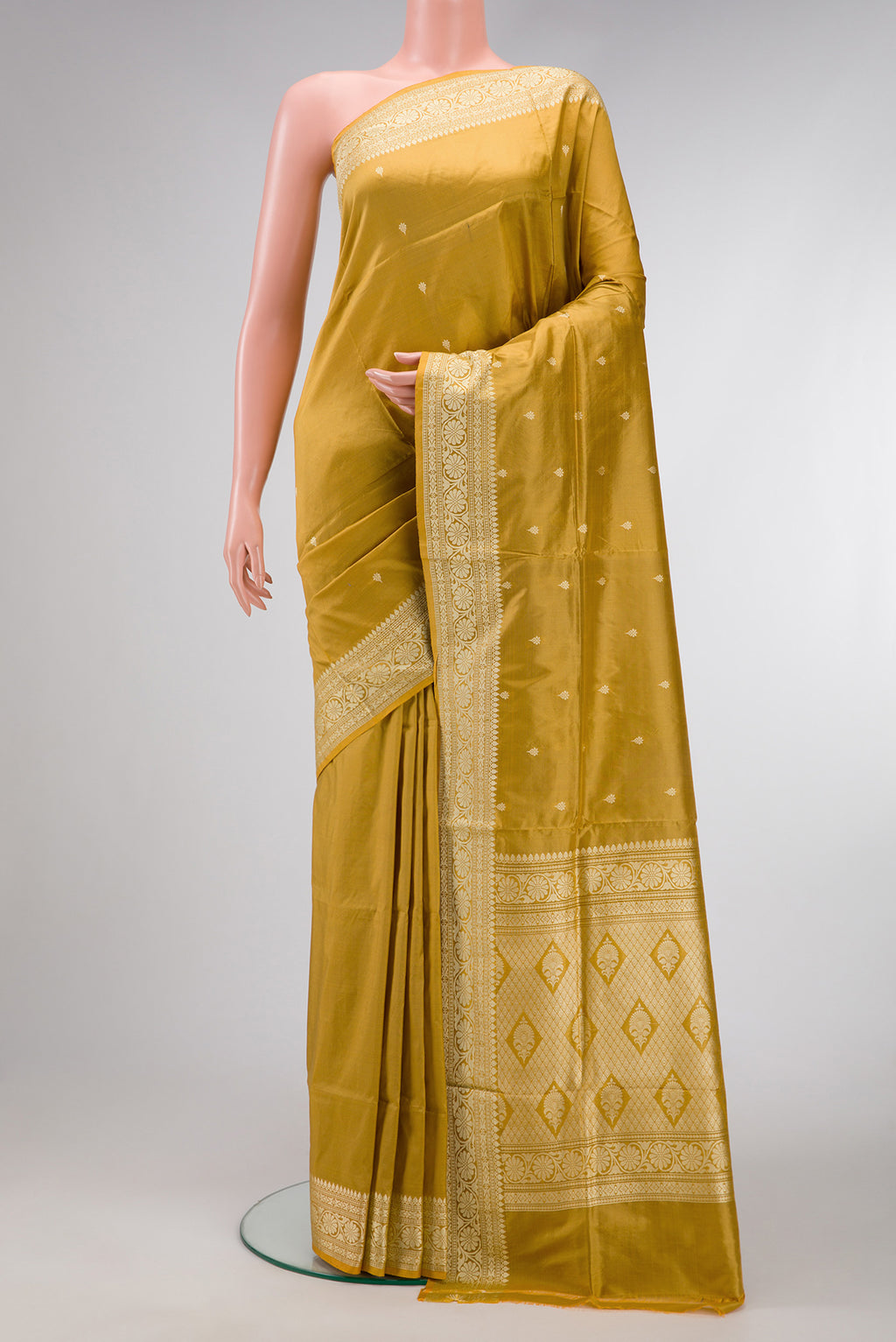 Gold Dual Tone Banarasi Silk Saree with Thread Butta on the body and Thread Border.  displayed on a mannequin