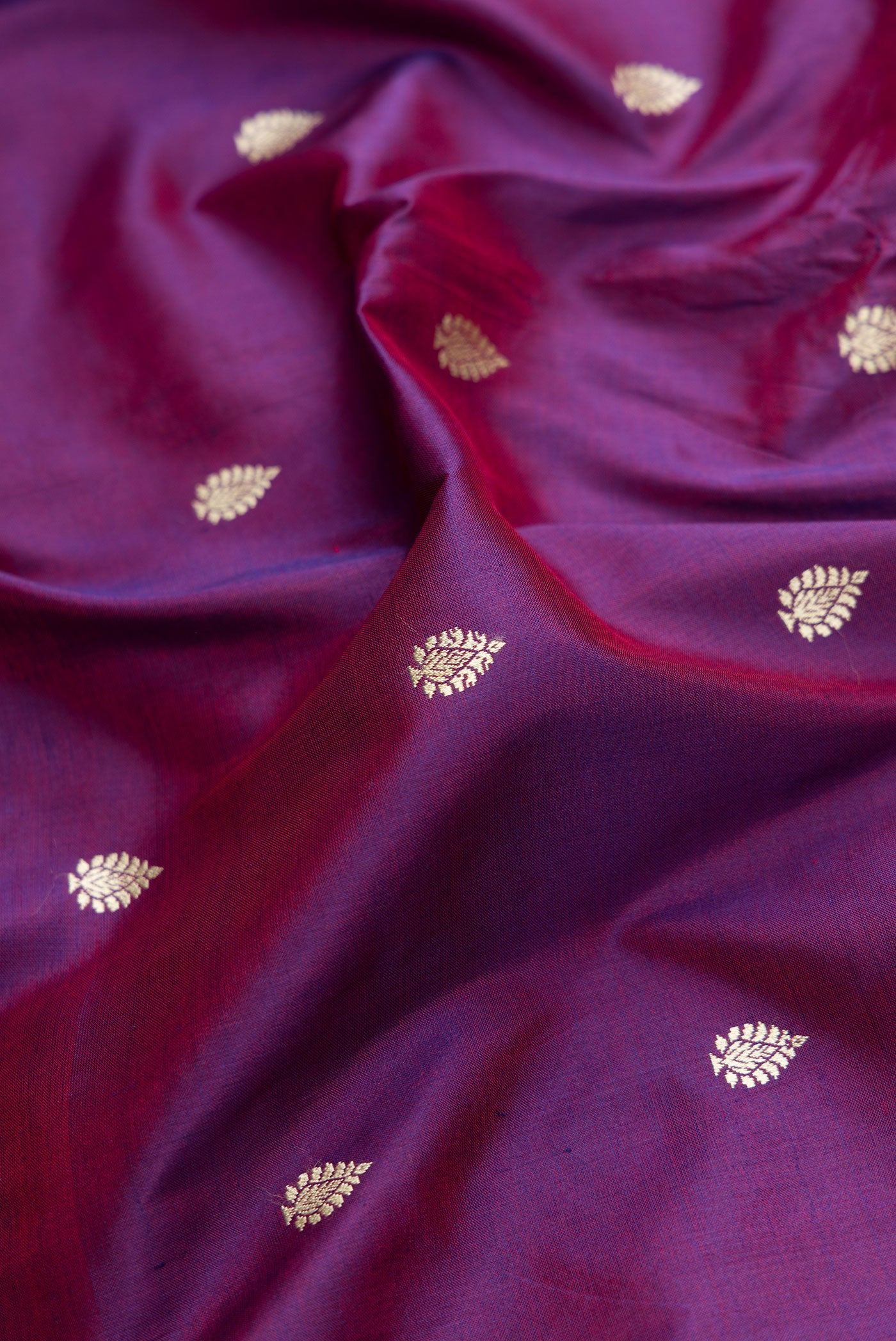 Close up of Purple Dual Tone Banarasi Silk Saree with Thread Butta on the body and Thread Border.  displaying folds
