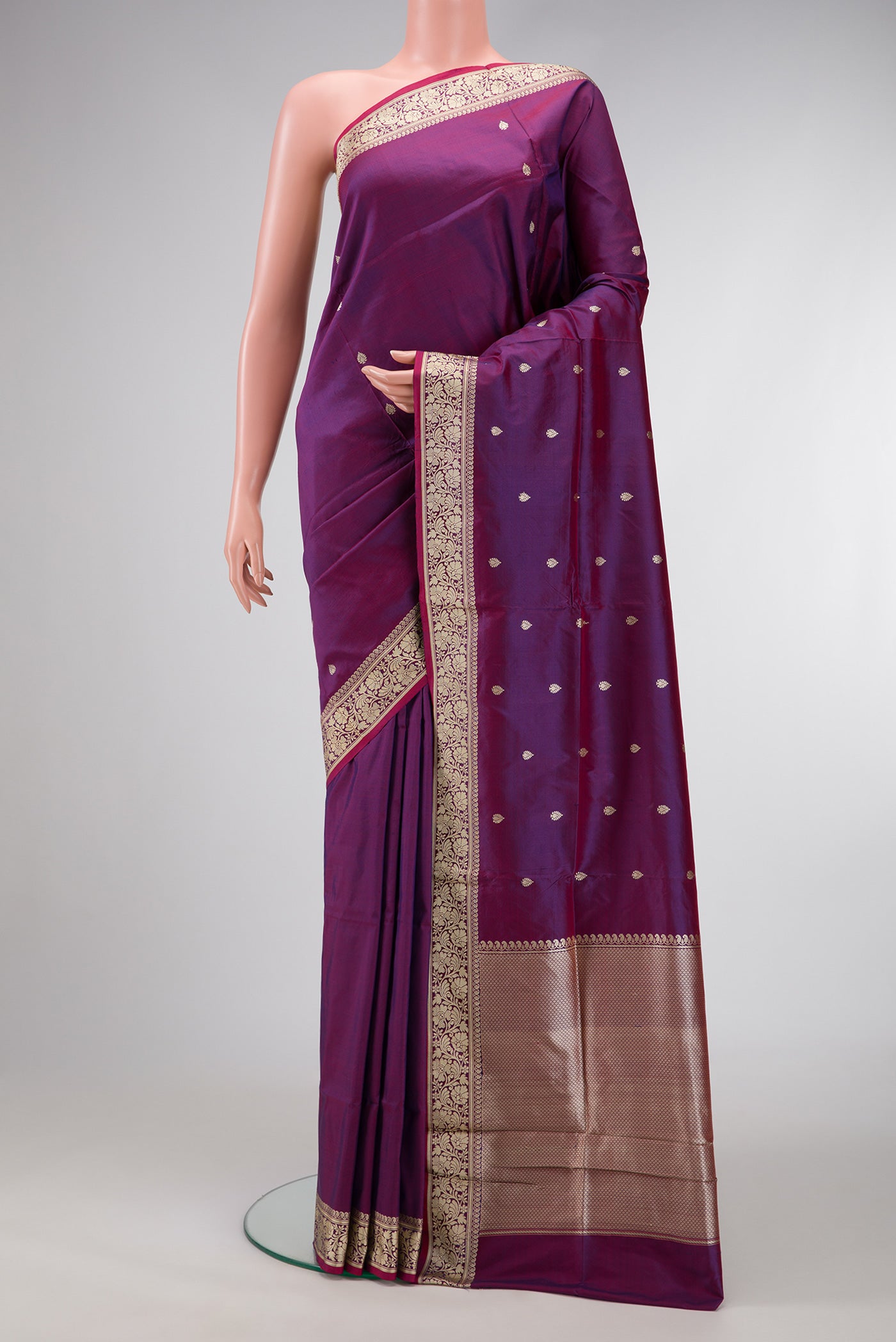 Purple Dual Tone Banarasi Silk Saree with Thread Butta on the body and Thread Border.  displayed on a mannequin