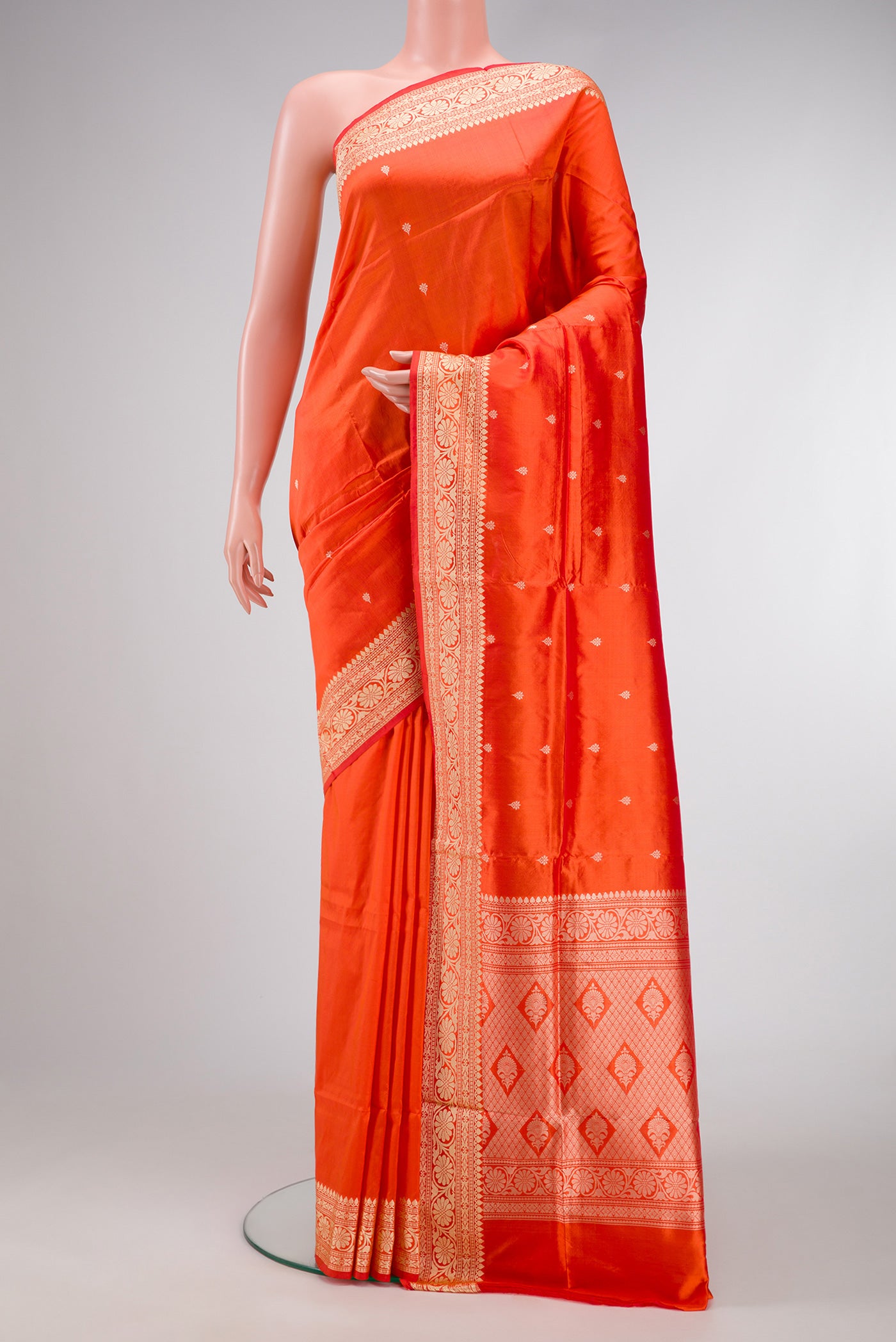 Orange Dual Tone Banarasi Silk Saree with Thread Butta on the body and Thread Border.  displayed on a mannequin