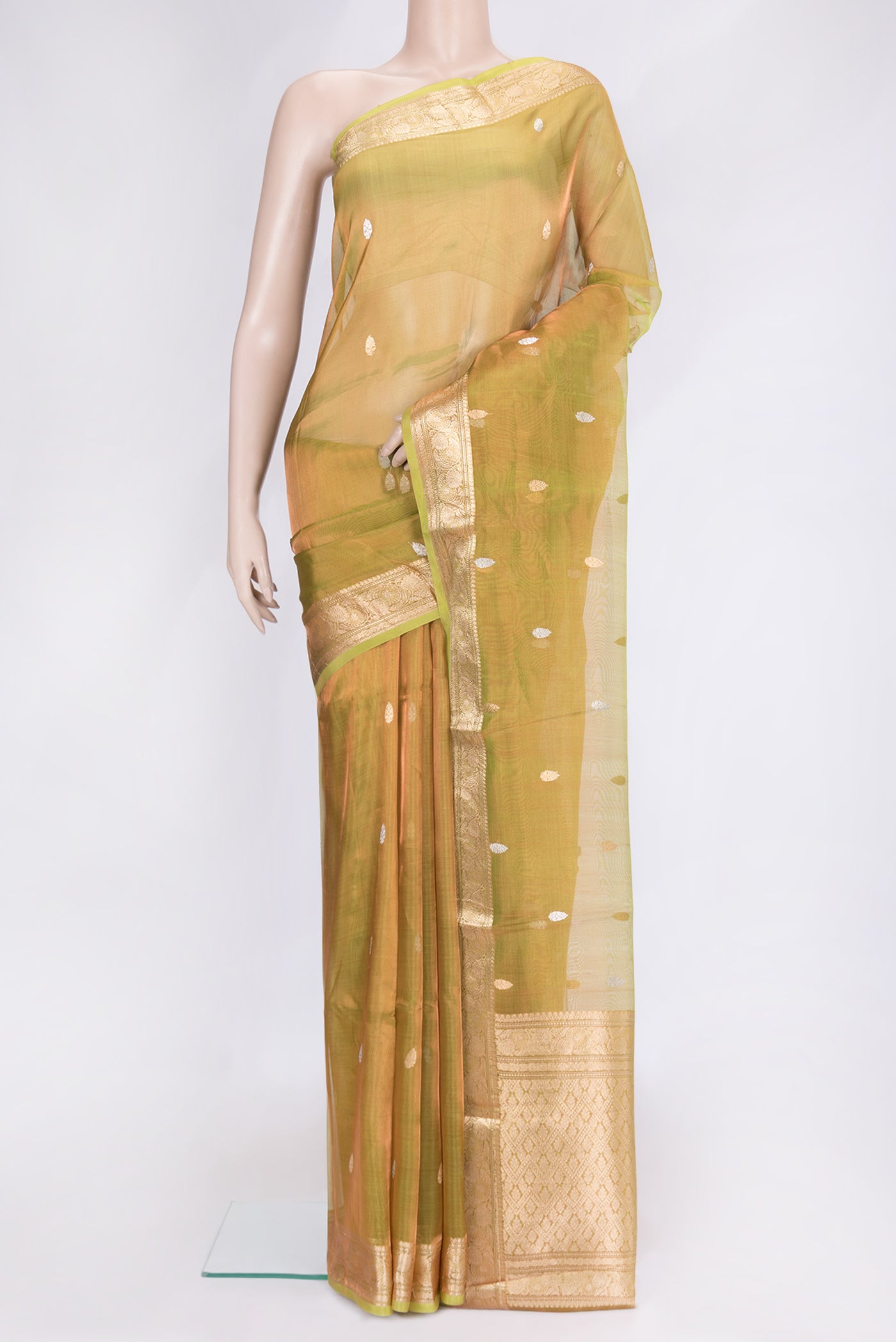 Parrot Green Dual Tone Organza Silk Saree with Zari Butta on the body and Zari Border.  displayed on a mannequin