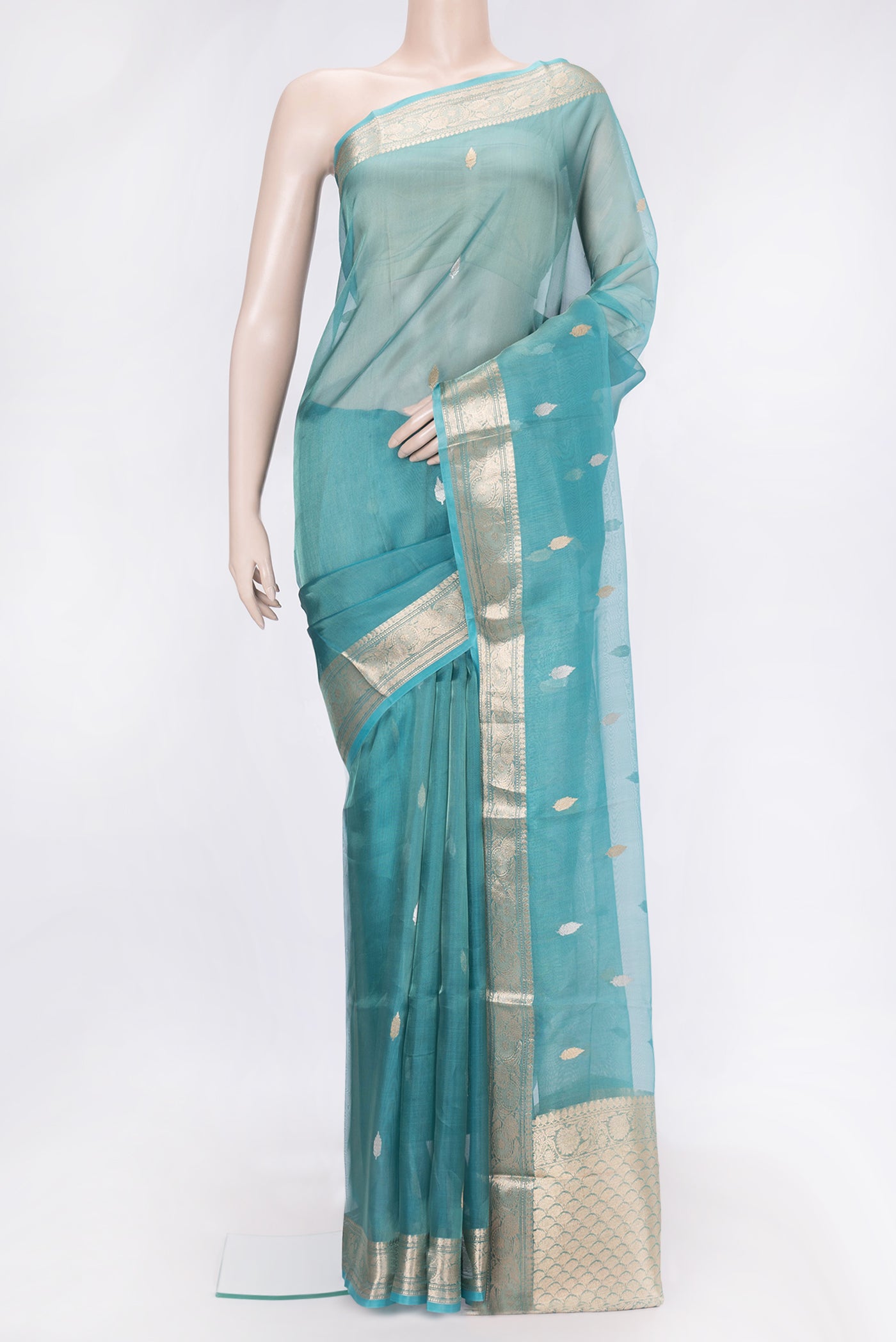 Sky Blue Dual Tone Organza Silk Saree with Zari Butta on the body and Zari Border.  displayed on a mannequin