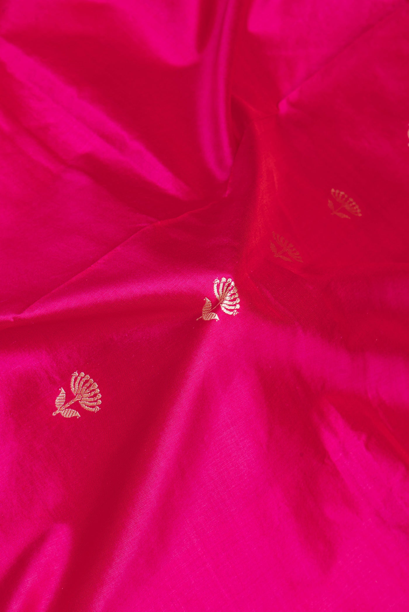 Close up of Pink Banarasi Silk Saree with Thread Butta on the body and Thread Border.  displaying folds