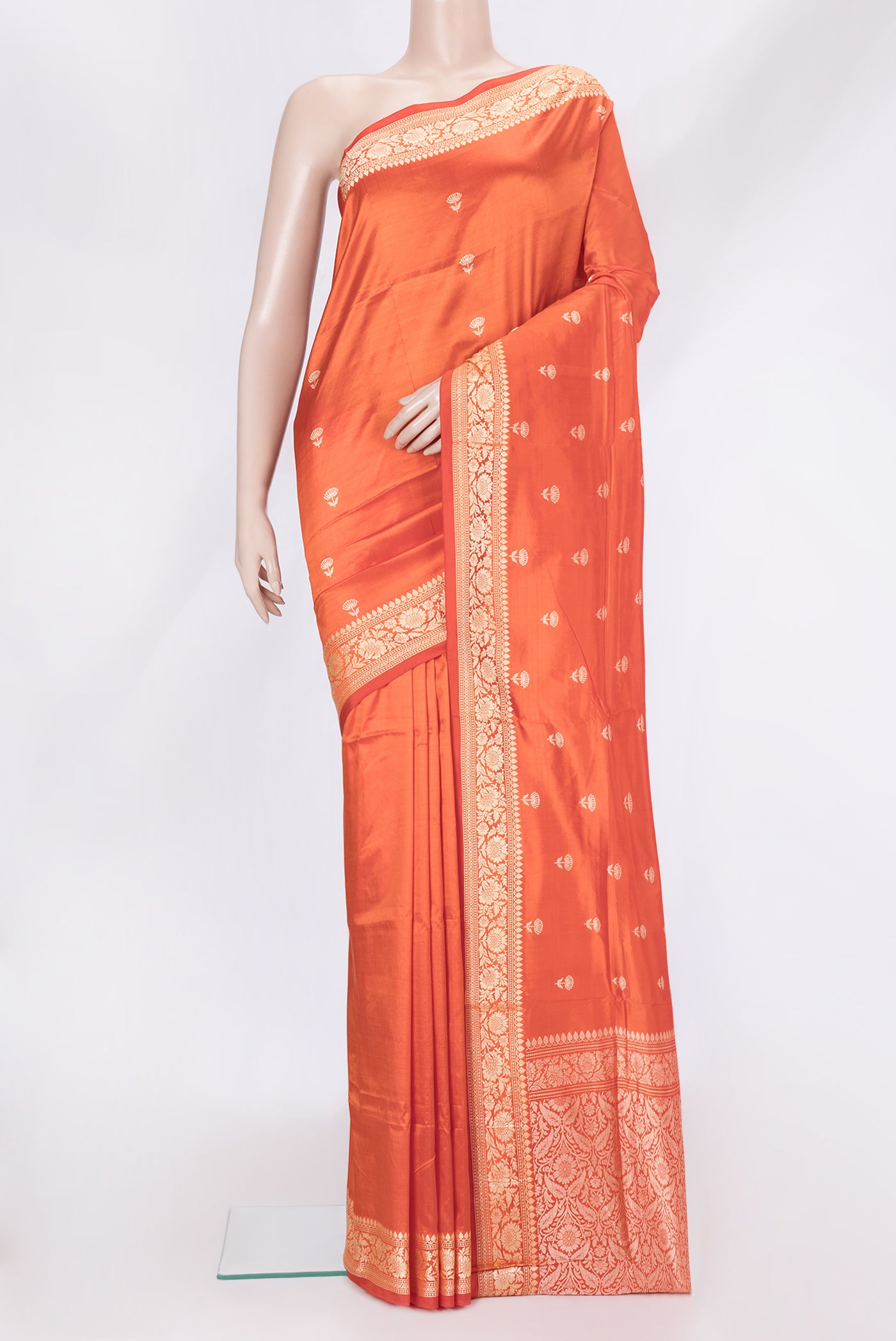 Orange Dual Tone Banarasi Silk Saree with Thread Butta on the body and Thread Border.  displayed on a mannequin