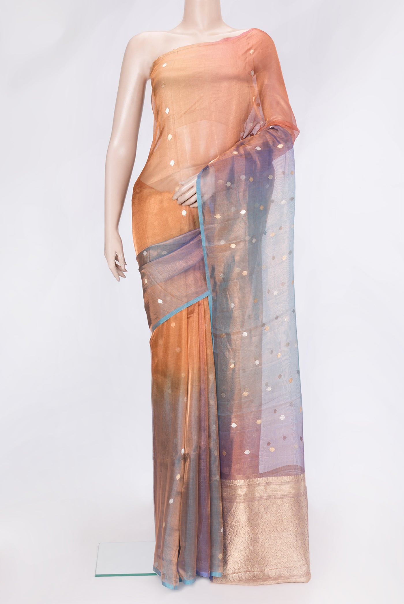 Lavender and Orange Color Organza Silk Saree with Zari Butta on the body and Without Border.  displayed on a mannequin