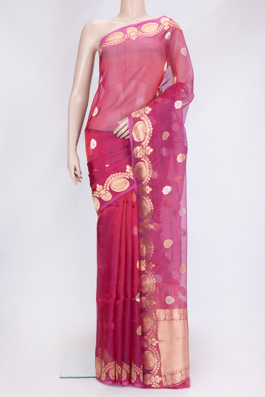 Dark Pink Dual Tone Organza Silk Saree with Zari Butta on the body and Fancy Border.  displayed on a mannequin
