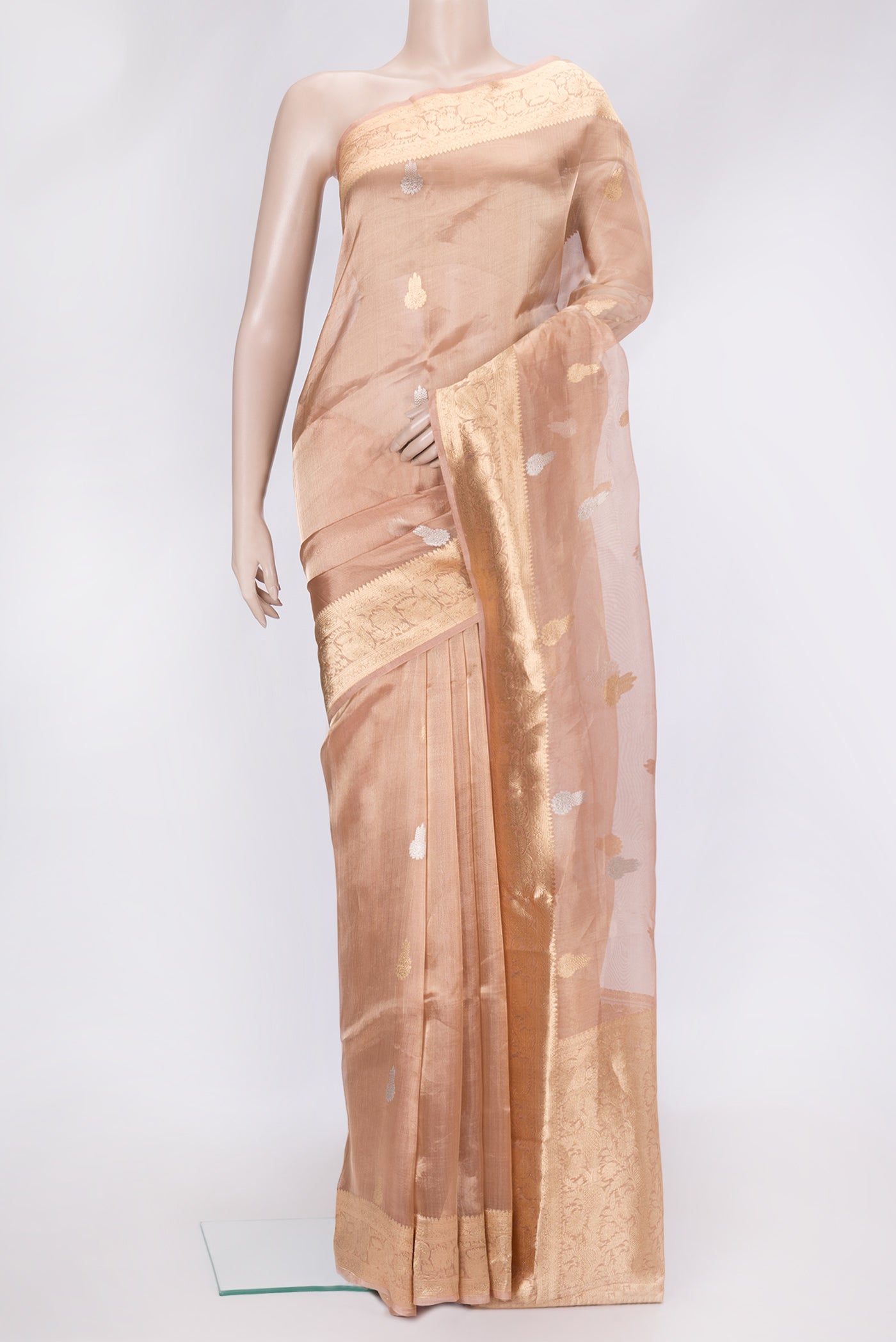 Rose Gold Dual Tone Organza Silk Saree with Zari Butta on the body and Zari Border.  displayed on a mannequin