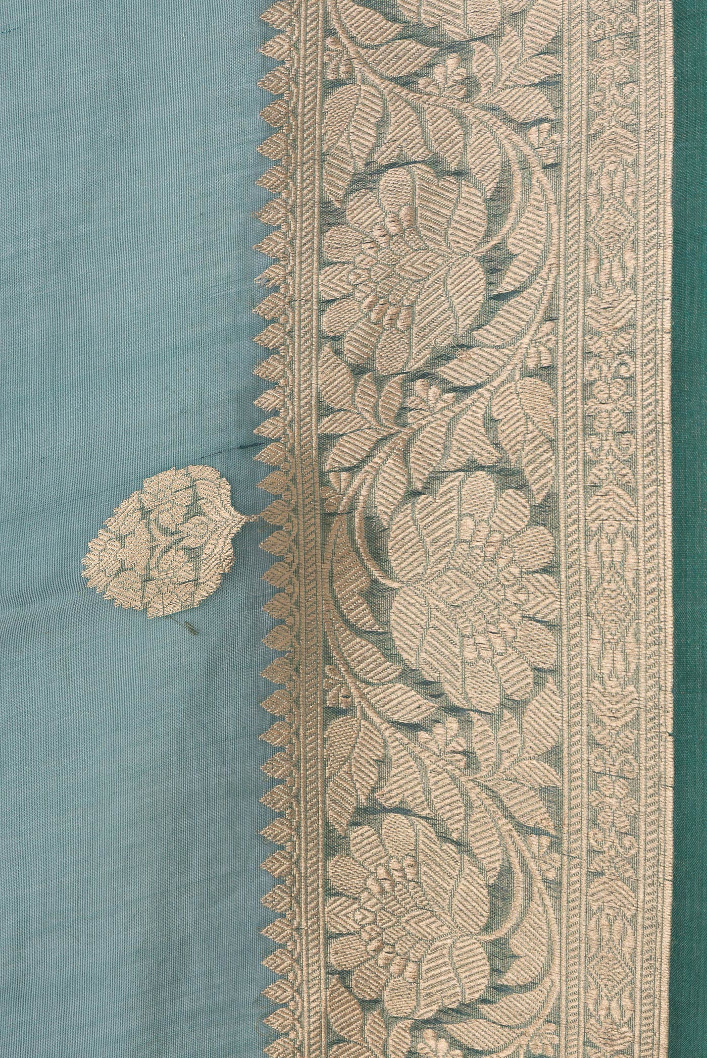 Border image of Peacock Blue Dual Tone Organza Silk Saree with Zari Butta on the body and Zari Border. 