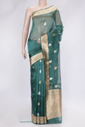Peacock Blue Dual Tone Organza Silk Saree with Zari Butta on the body and Zari Border.  displayed on a mannequin