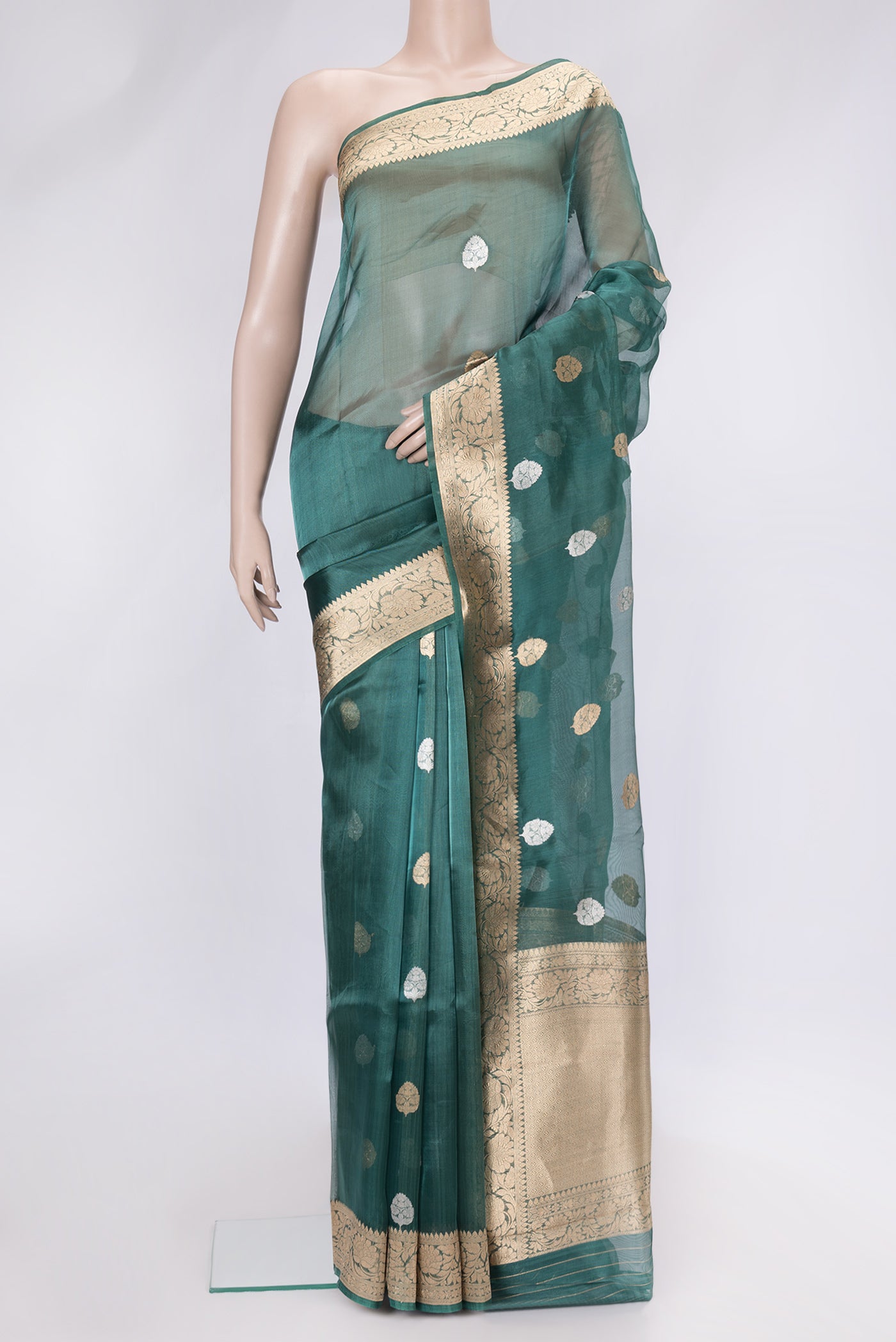 Peacock Blue Dual Tone Organza Silk Saree with Zari Butta on the body and Zari Border.  displayed on a mannequin