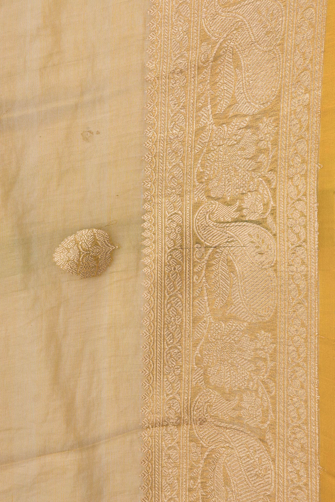 Border image of Gold Dual Tone Organza Silk Saree with Zari Butta on the body and Zari Border. 