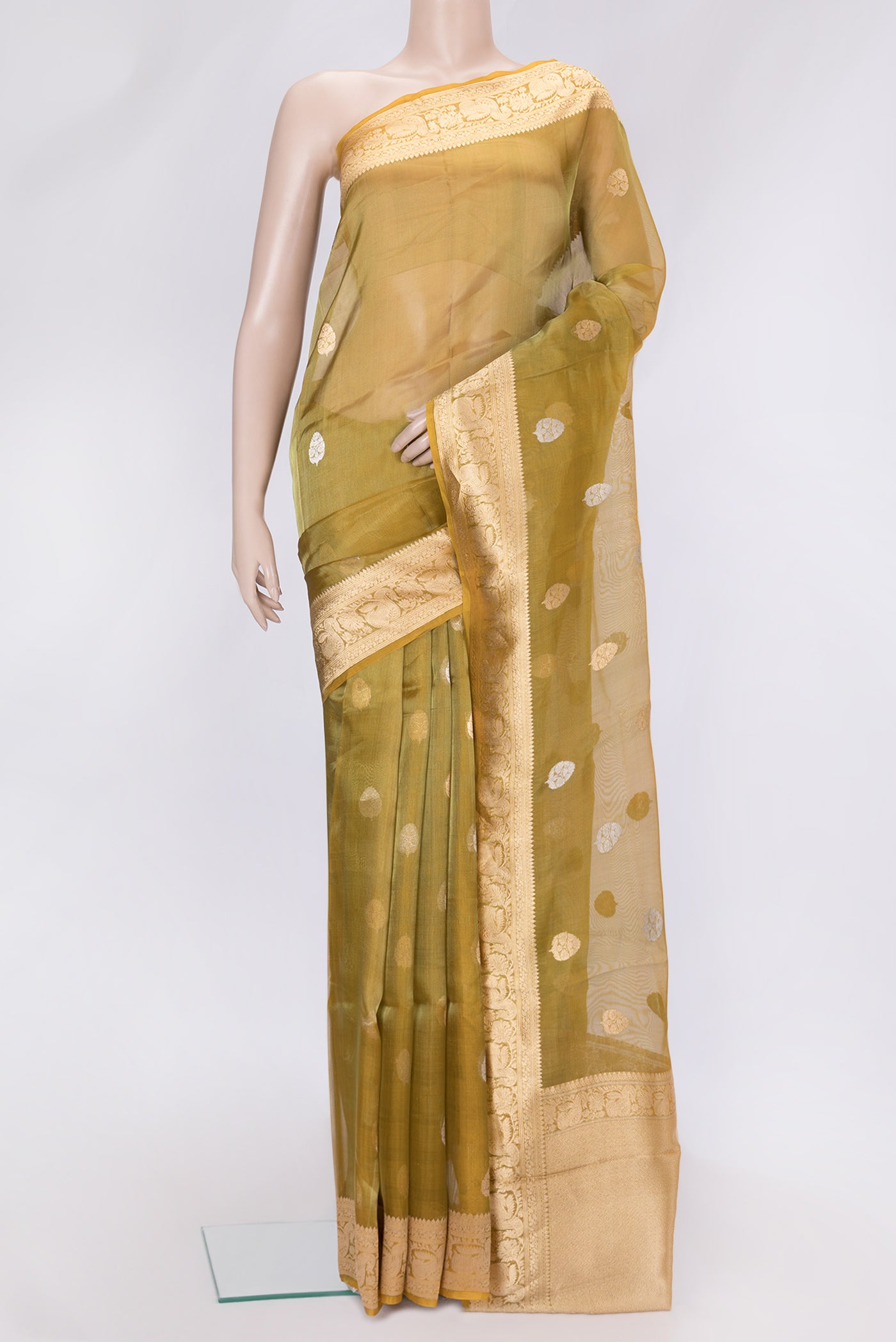 Gold Dual Tone Organza Silk Saree with Zari Butta on the body and Zari Border.  displayed on a mannequin