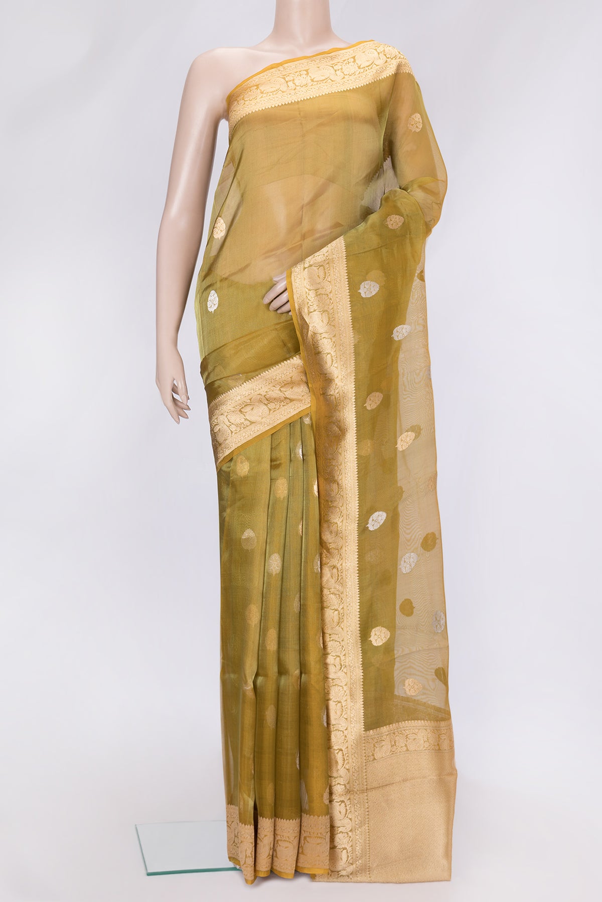 Gold Dual Tone Organza Silk Saree with Zari Butta on the body and Zari Border.  displayed on a mannequin