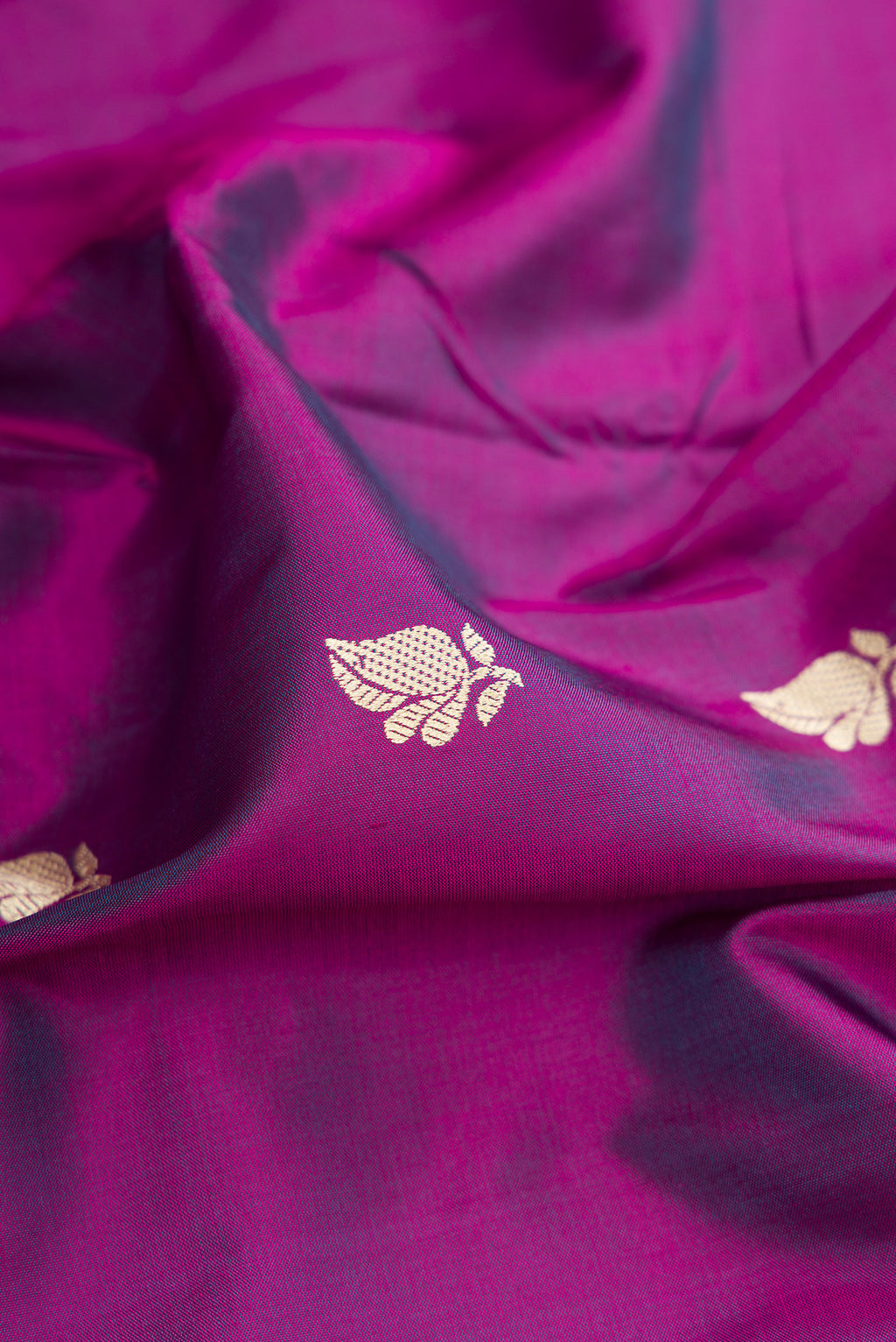 Close up of Purple Banarasi Silk Saree with Thread Butta on the body and Thread Border.  displaying folds