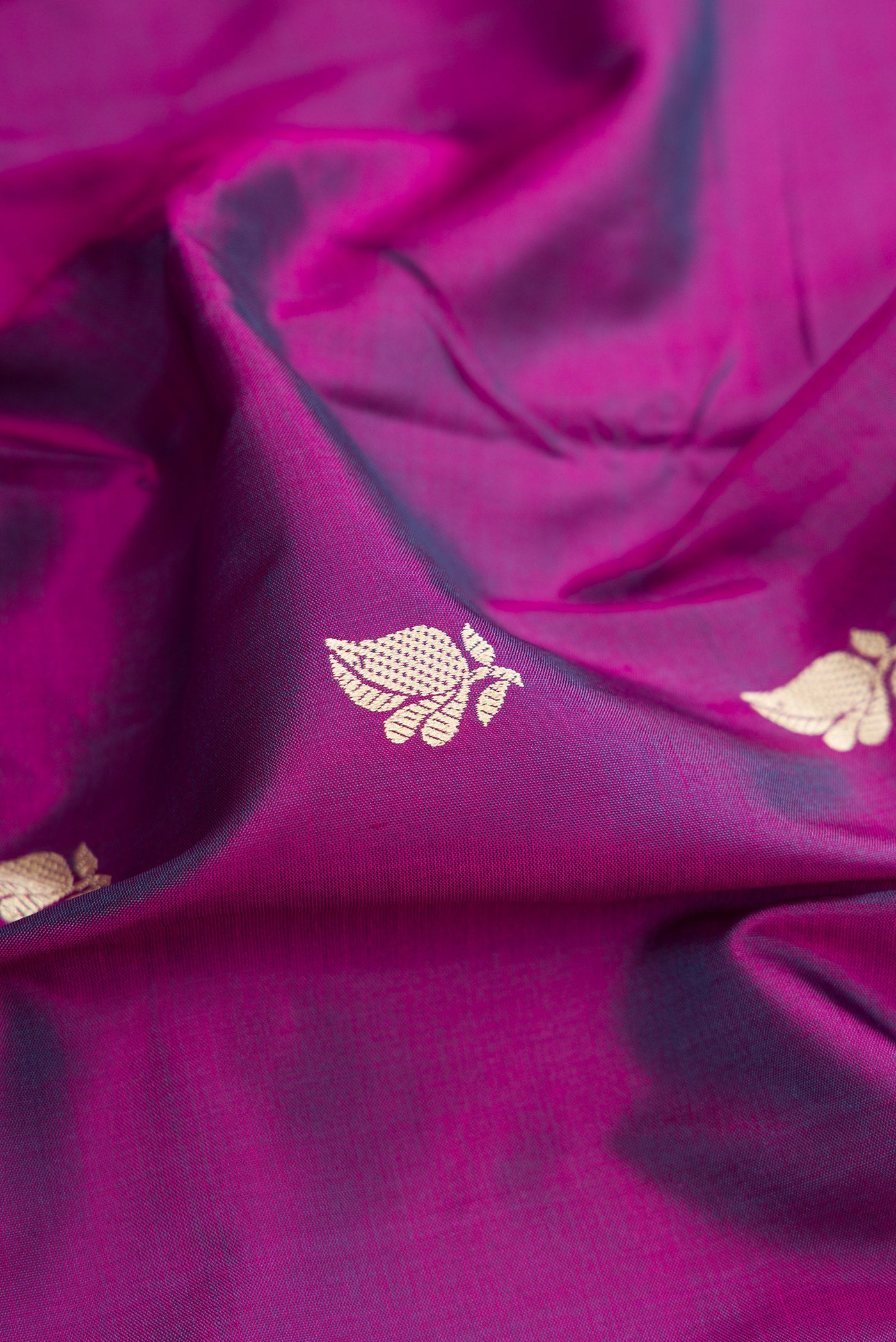 Close up of Purple Banarasi Silk Saree with Thread Butta on the body and Thread Border.  displaying folds