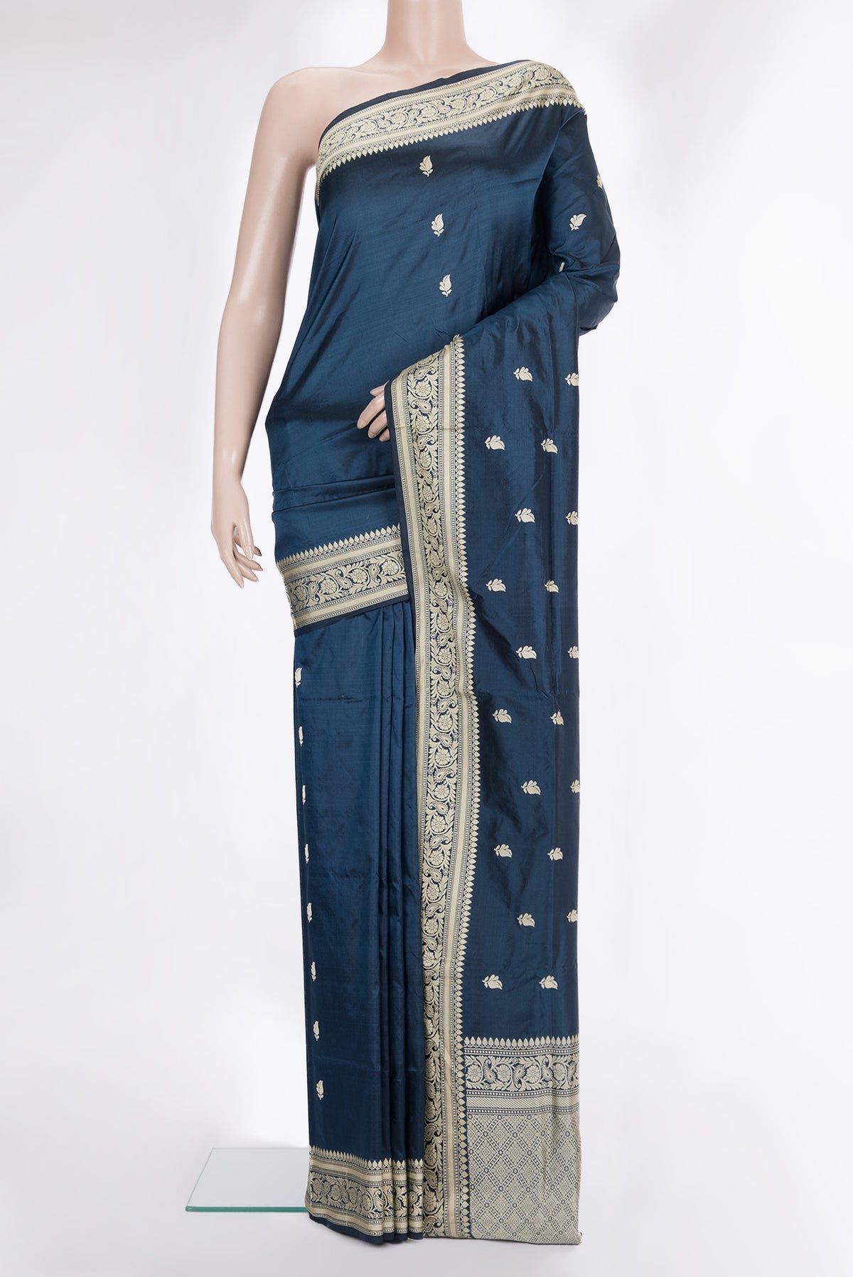 Pure Silk Peacock Blue Banarasi Katan Saree with Thread Butta on the body and Thread Border.  displayed on a mannequin