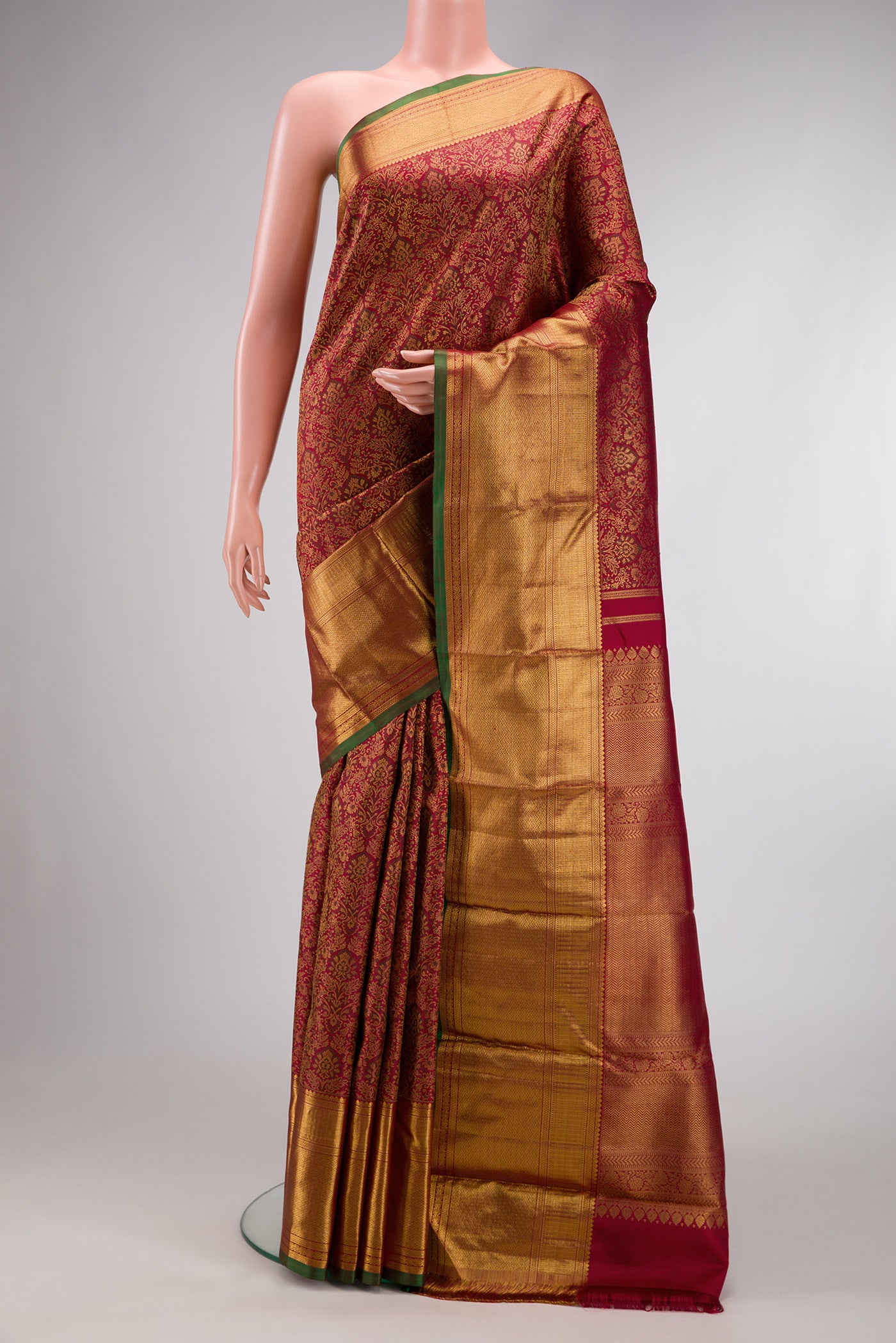 Maroon Dual Tone Kanchipuram Silk Saree with Zari Brocade on the body and Zari Border.  displayed on a mannequin