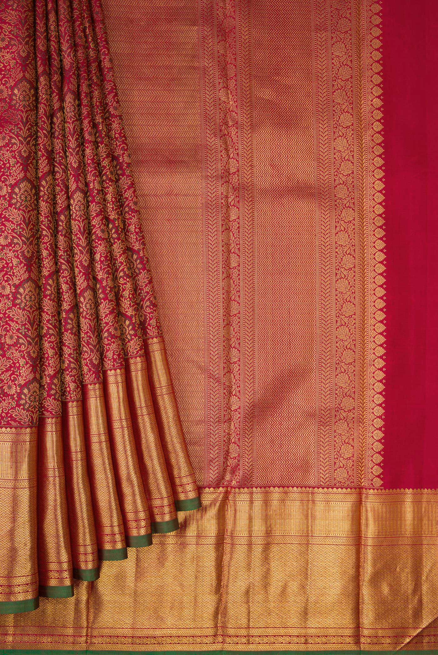 Pleats and pallu of Maroon Dual Tone Kanchipuram Silk Saree with Zari Brocade on the body and Zari Border. 
