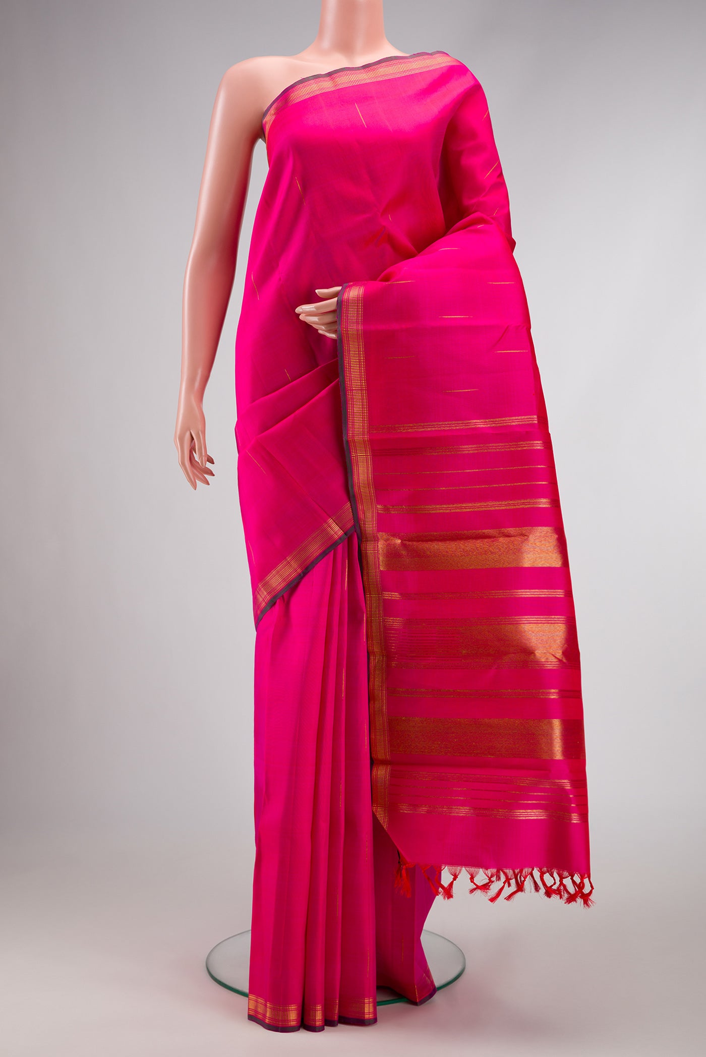 Pure Silk Pure Zari Pink Dual Tone Kanchipuram Saree with Zari Butta on the body and Zari Border.  displayed on a mannequin