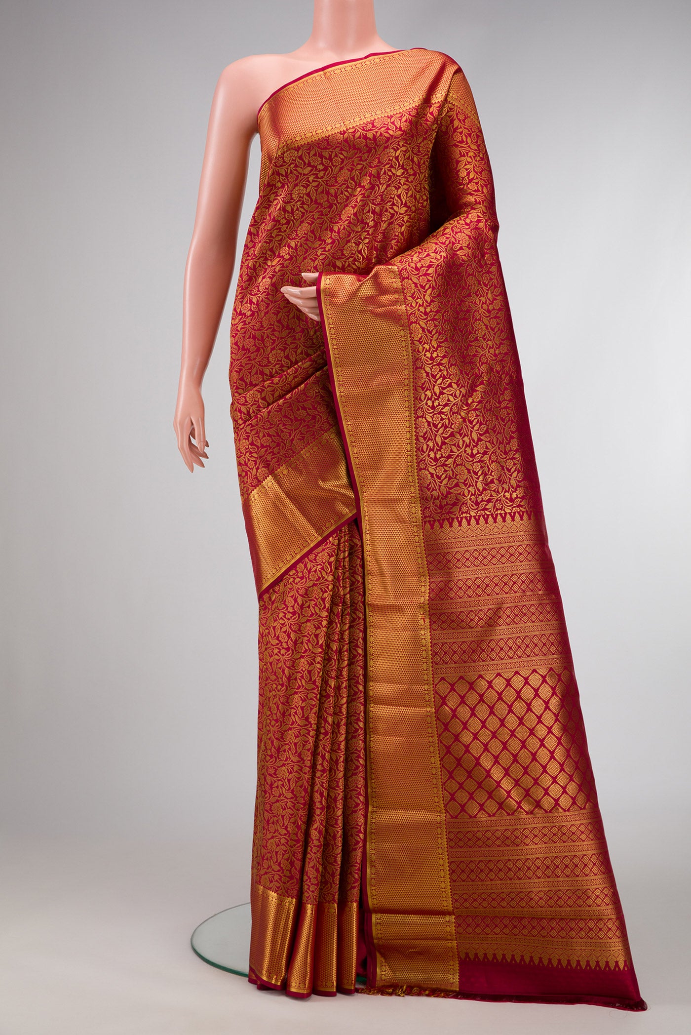 Maroon Dual Tone Kanjivaram Silk Saree with Zari Brocade on the body and Zari Border.  displayed on a mannequin