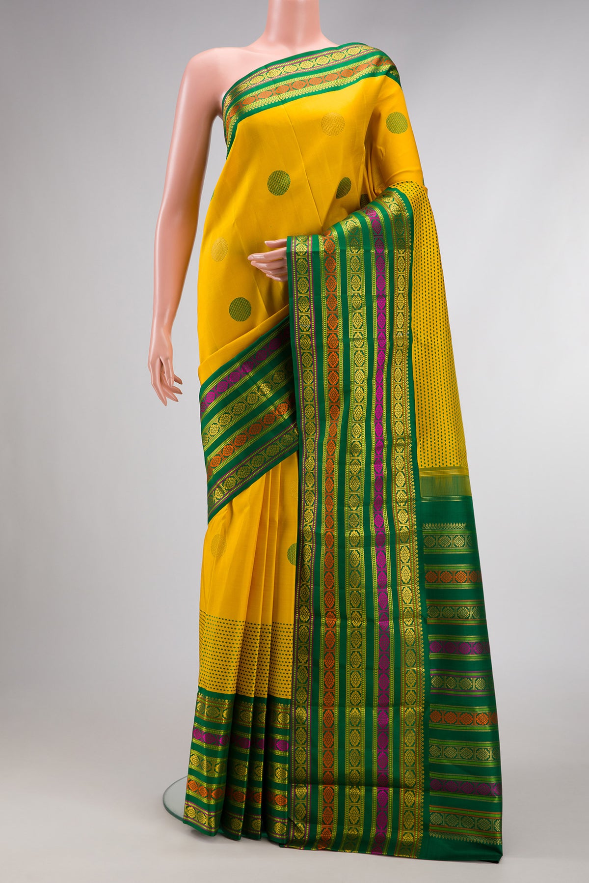 Pure Silk Pure Zari Yellow Dual Tone Kanchipuram Saree with Zari And Thread Butta on the body and Fancy Border.  displayed on a mannequin