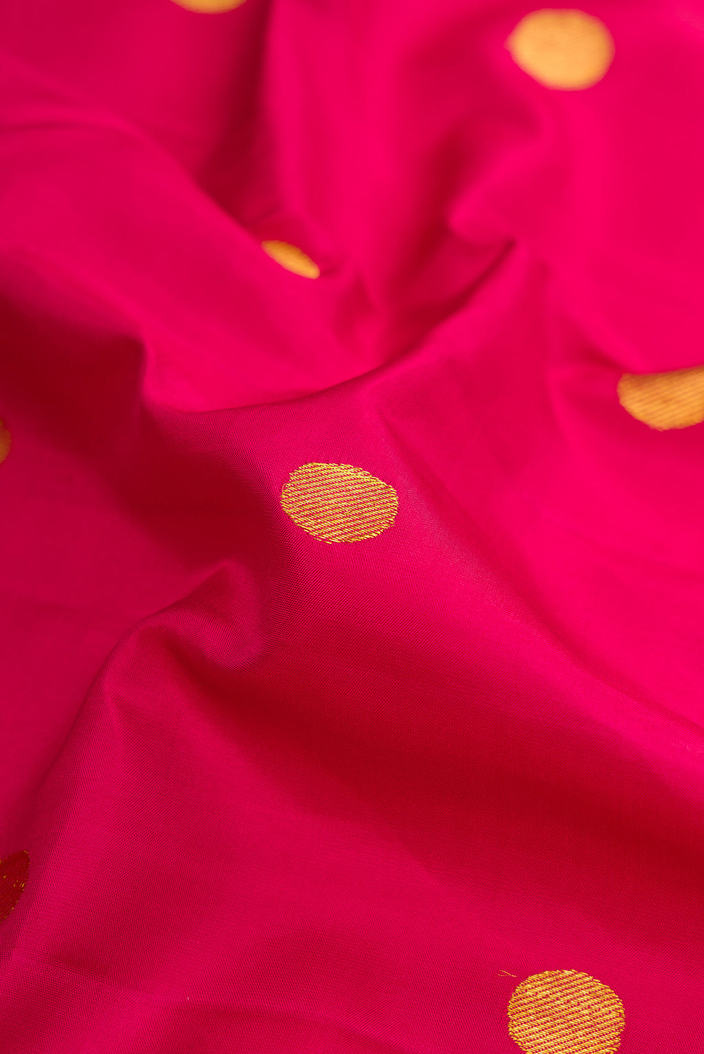 Close up of Pure Silk Pure Zari Maroon Dual Tone Kanjivaram Nine Yards Saree with Zari Butta on the body and Zari Border.  displaying folds
