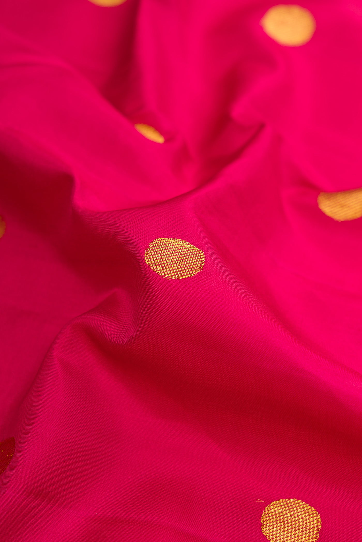 Close up of Pure Silk Pure Zari Maroon Dual Tone Kanjivaram Nine Yards Saree with Zari Butta on the body and Zari Border.  displaying folds