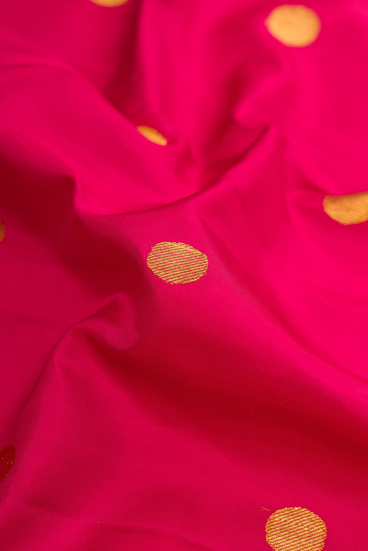 Close up of Pure Silk Pure Zari Maroon Dual Tone Kanjivaram Nine Yards Saree with Zari Butta on the body and Zari Border.  displaying folds