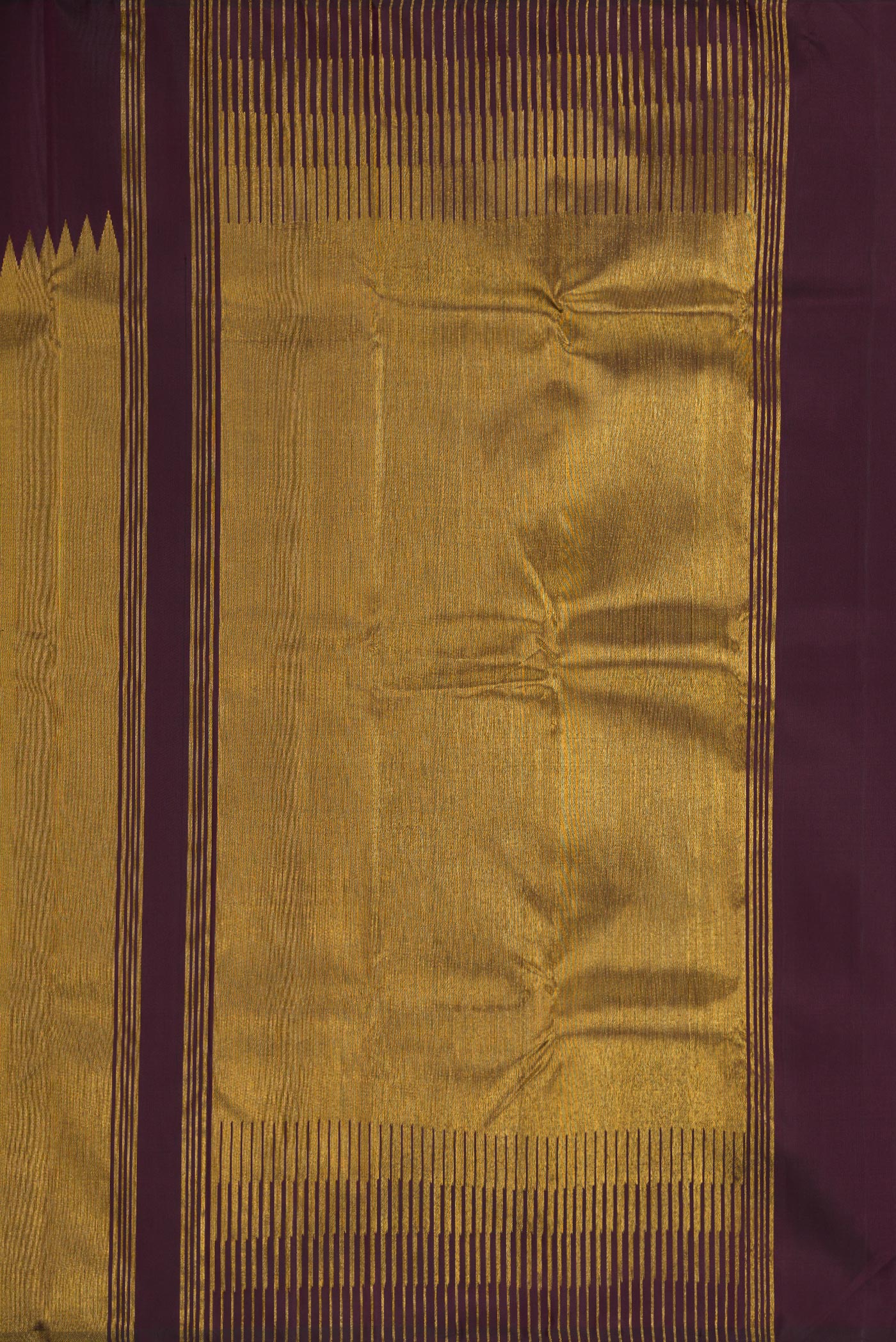 Close up image of the pallu of Burgundy Dual Tone Kanjivaram Silk Saree with Plain Body and Rising Temple Border. 