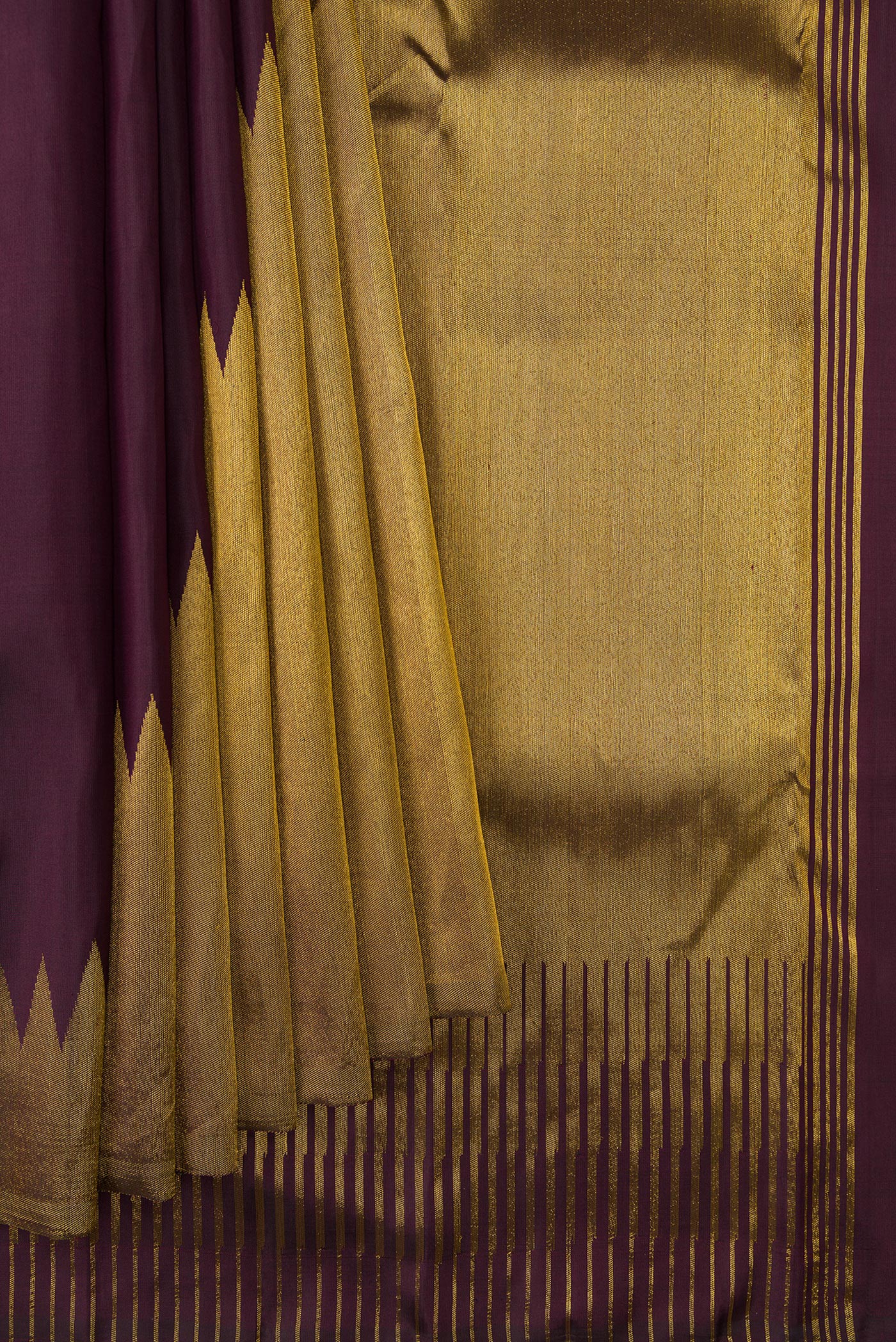 Pleats and pallu of Burgundy Dual Tone Kanjivaram Silk Saree with Plain Body and Rising Temple Border. 