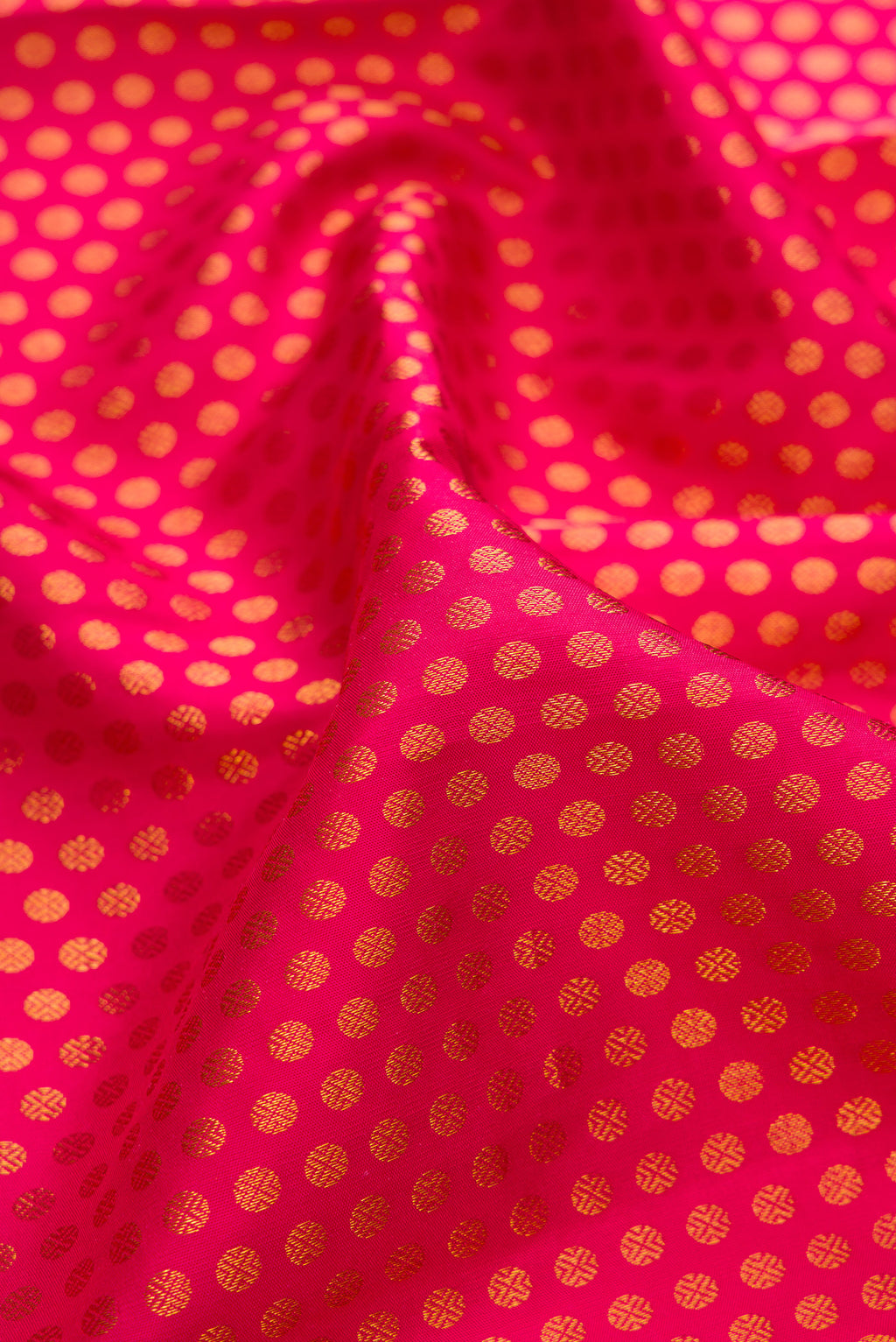 Close up of Pure Silk Pink Kanjivaram Saree with Zari Brocade on the body and Zari Border.  displaying folds