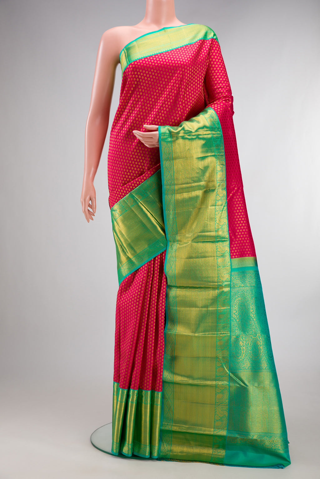 Pure Silk Pink Kanjivaram Saree with Zari Brocade on the body and Zari Border.  displayed on a mannequin