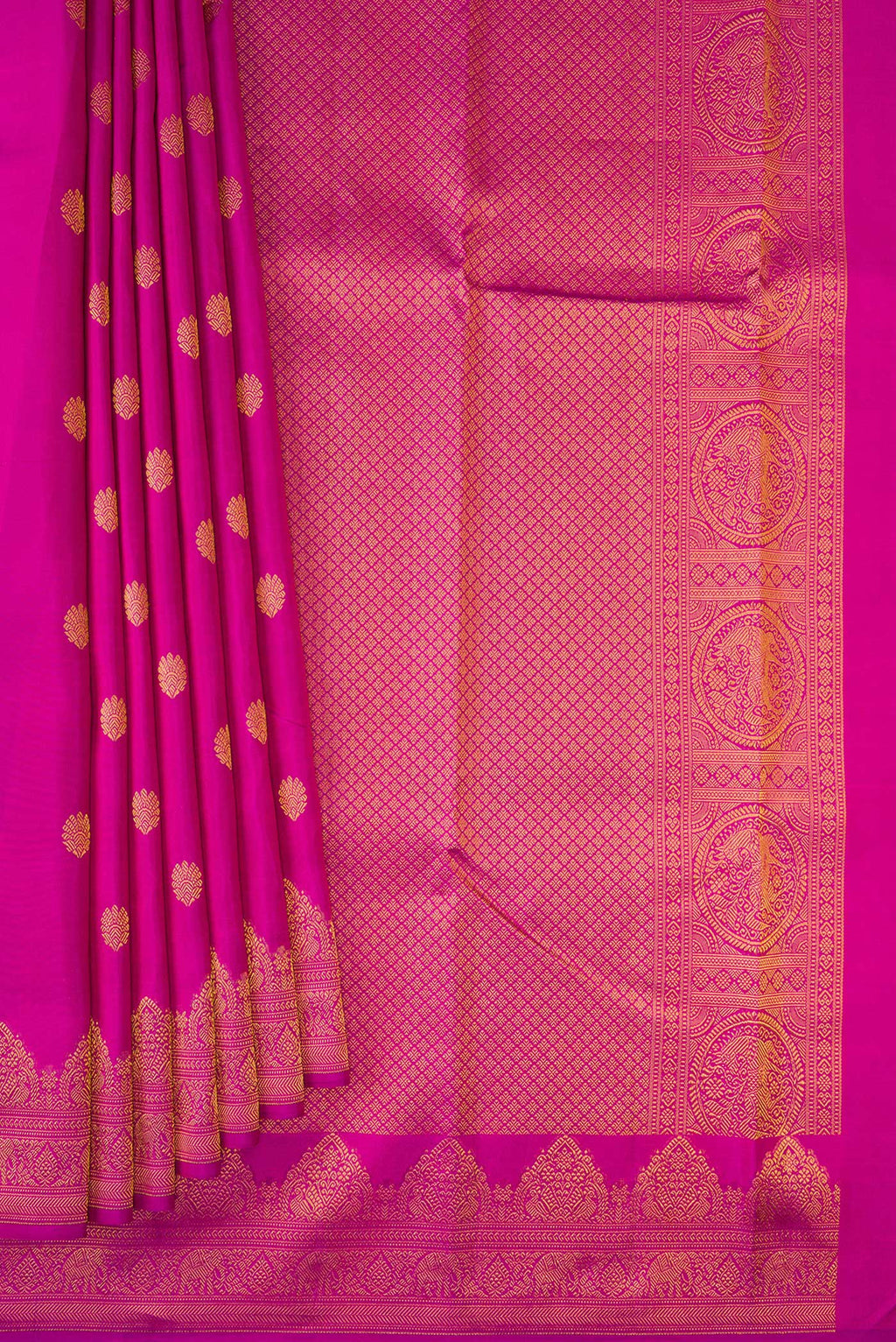 Pleats and pallu of Magenta Kanchipuram Silk Saree with Zari Butta on the body and Fancy Border. 