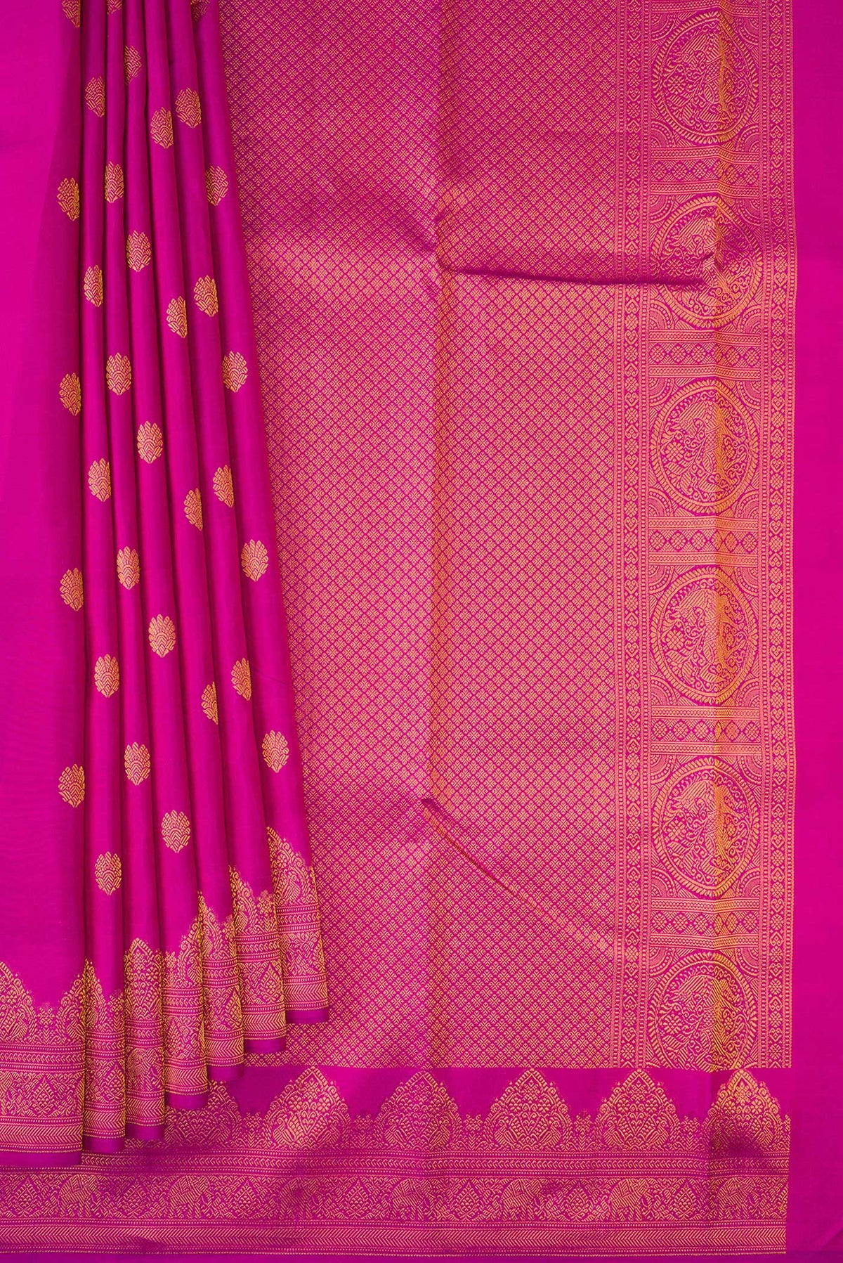 Pleats and pallu of Magenta Kanchipuram Silk Saree with Zari Butta on the body and Fancy Border. 