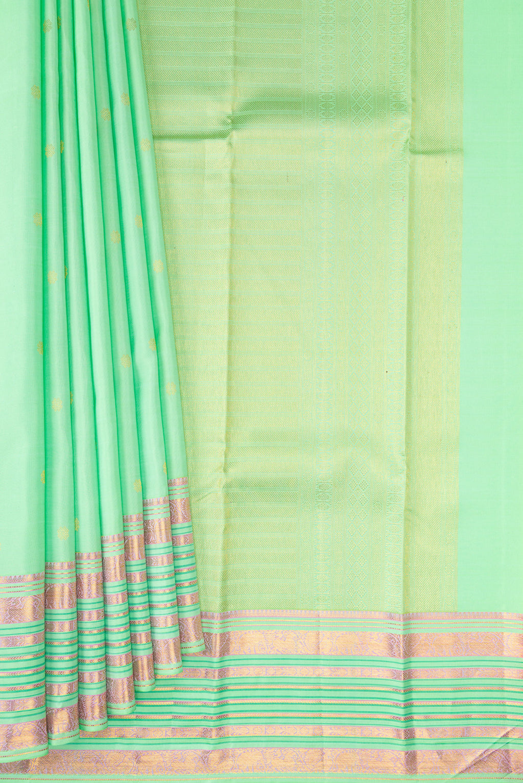 Pleats and pallu of Pista Green Kanchipuram Silk Saree with Zari Butta on the body and Fancy Border. 
