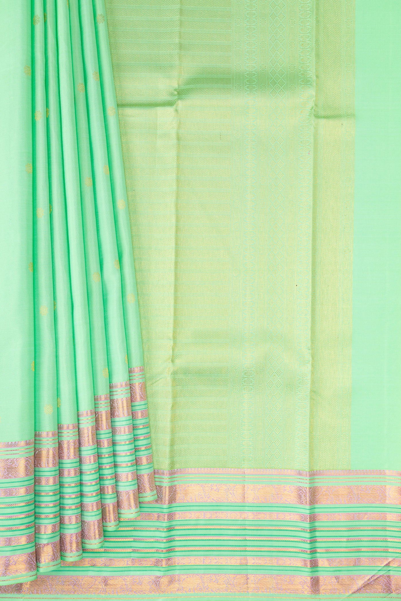 Pleats and pallu of Pista Green Kanchipuram Silk Saree with Zari Butta on the body and Fancy Border. 