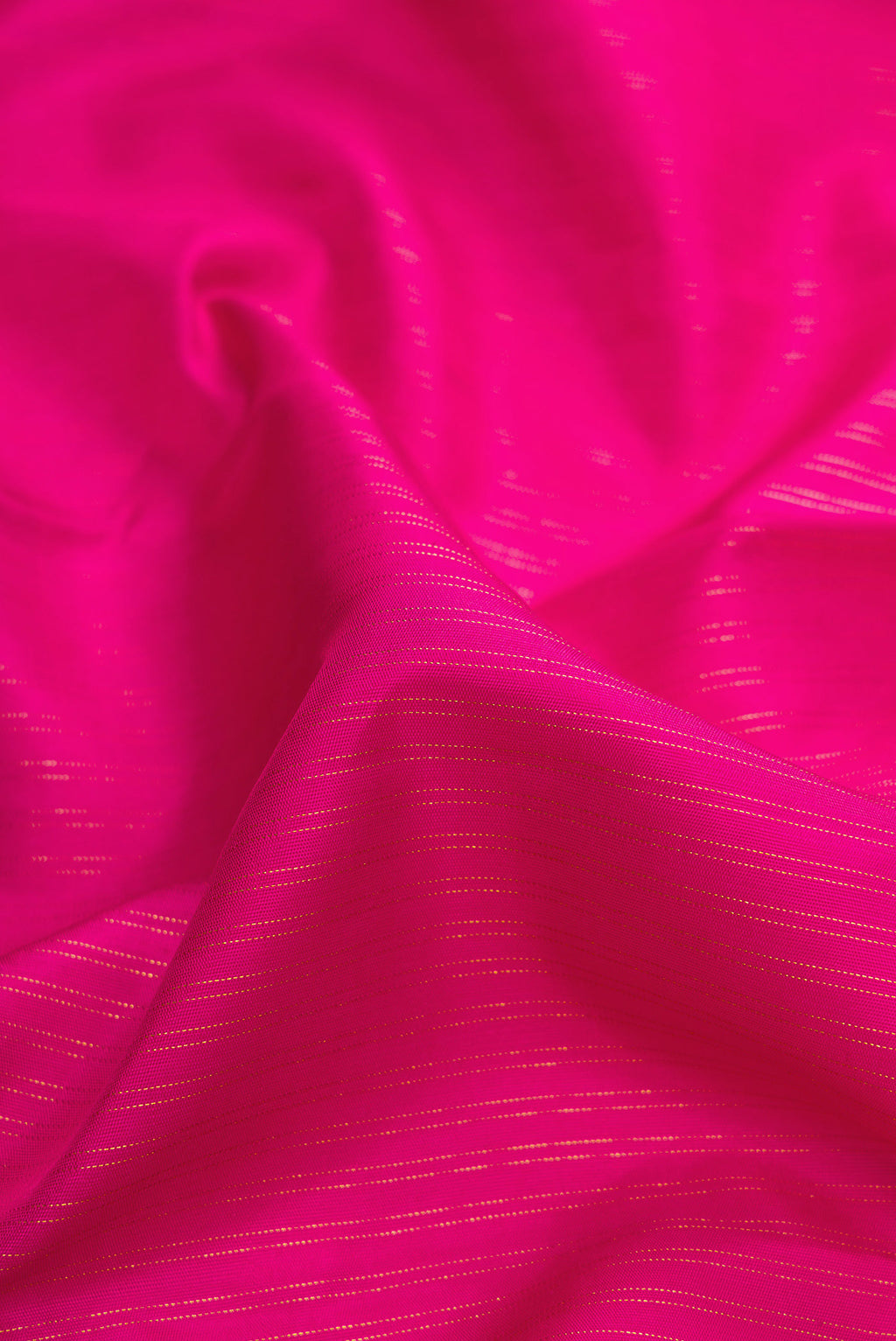 Close up of Pink Dual Tone Kanchipuram Silk Saree with Stripes on the body and Fancy Border.  displaying folds