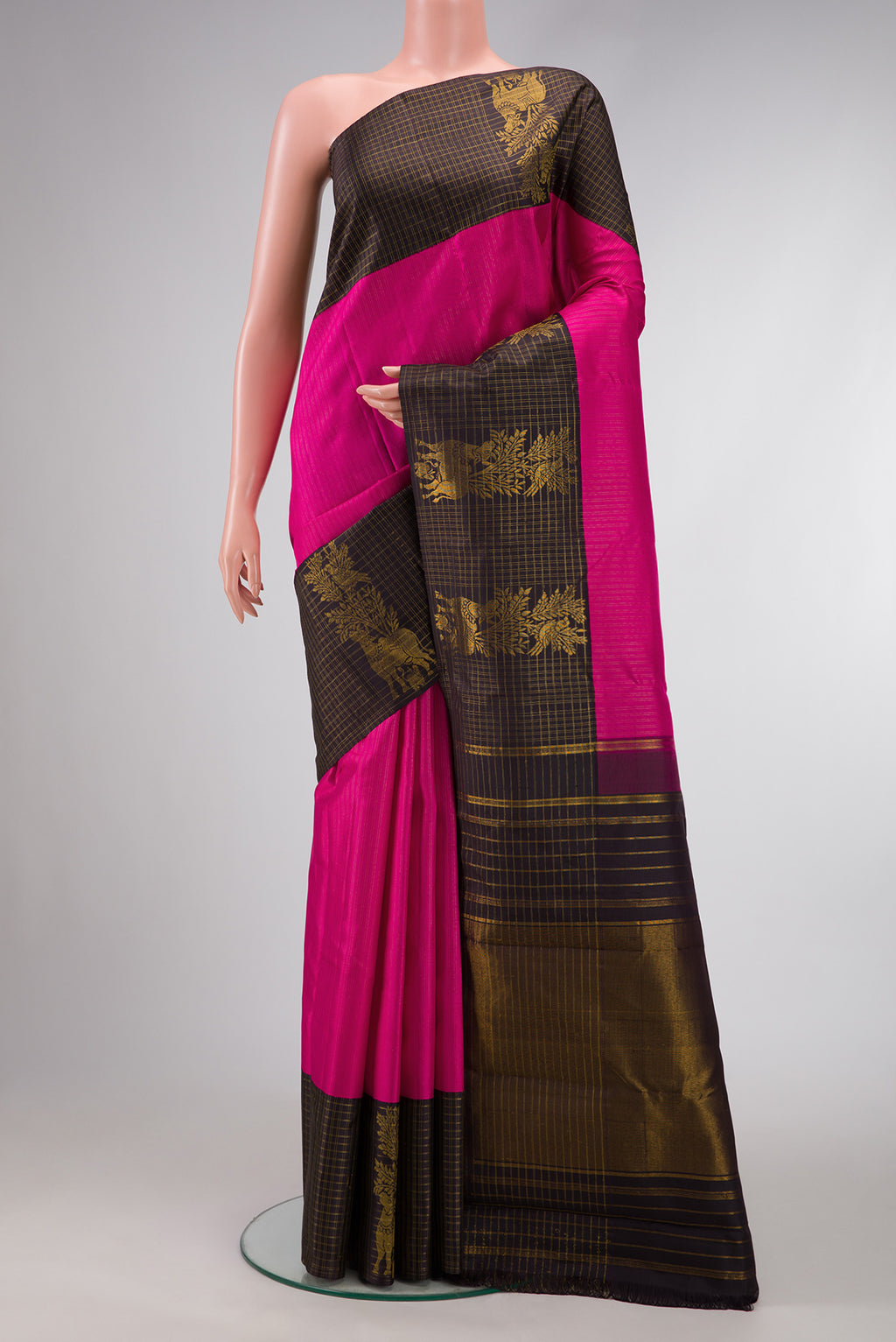 Pink Dual Tone Kanchipuram Silk Saree with Stripes on the body and Fancy Border.  displayed on a mannequin