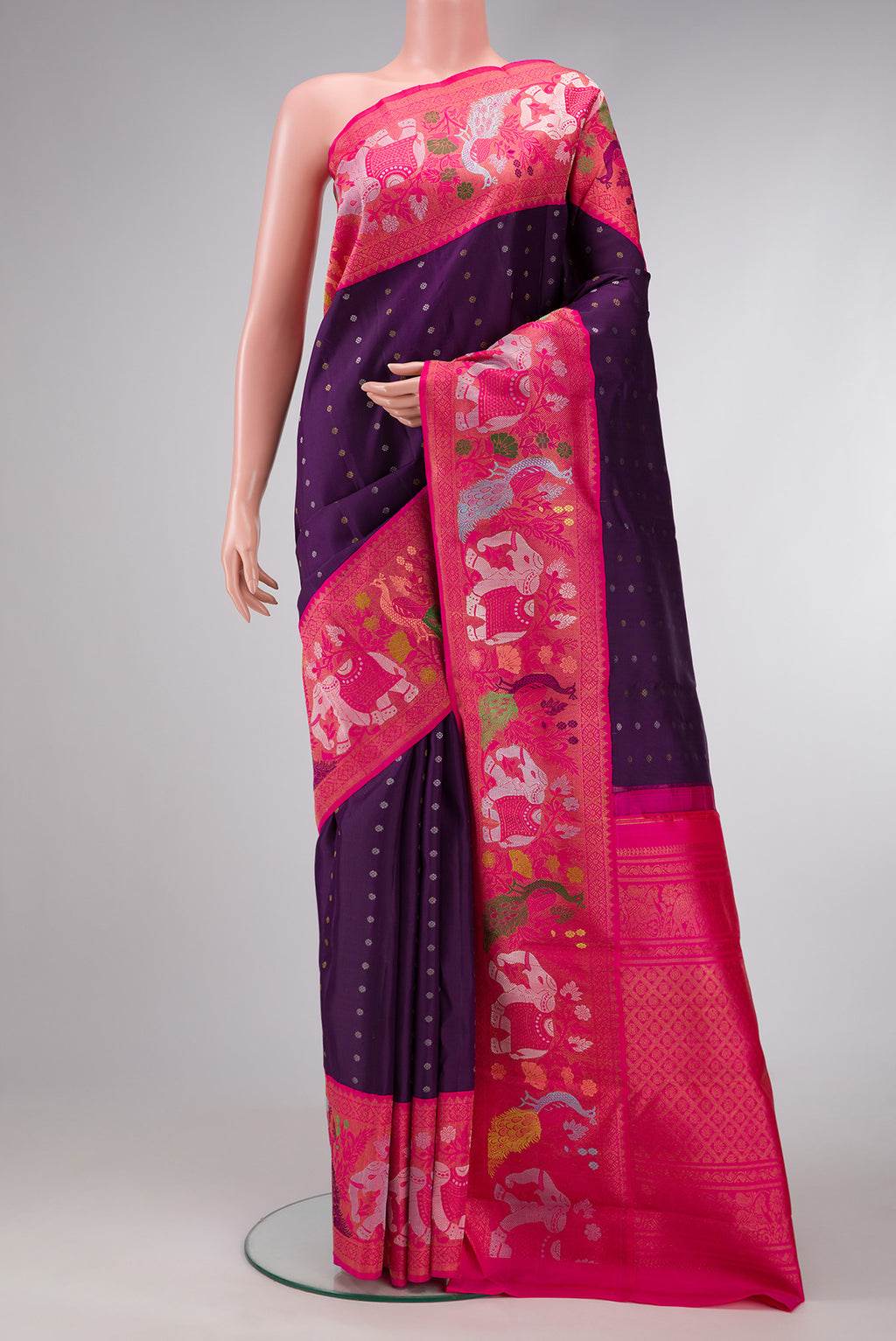 Pure Silk Pure Zari Navy Blue Dual Tone Kanjivaram Saree with Zari Butta on the body and Fancy Border.  displayed on a mannequin