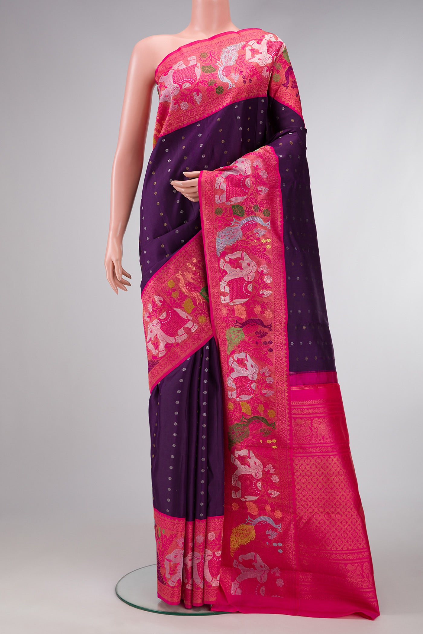 Pure Silk Pure Zari Navy Blue Dual Tone Kanjivaram Saree with Zari Butta on the body and Fancy Border.  displayed on a mannequin