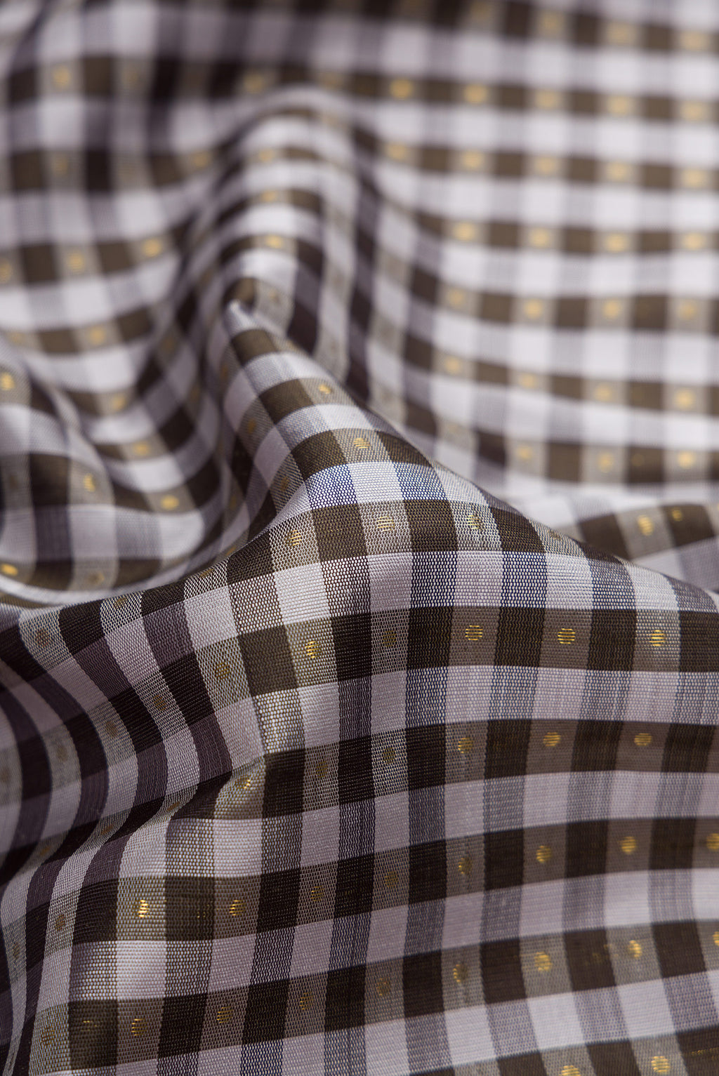 Close up of Pure Silk Pure Zari Black and Grey Color Kanjivaram Saree with Checked design on the body and Zari Border.  displaying folds