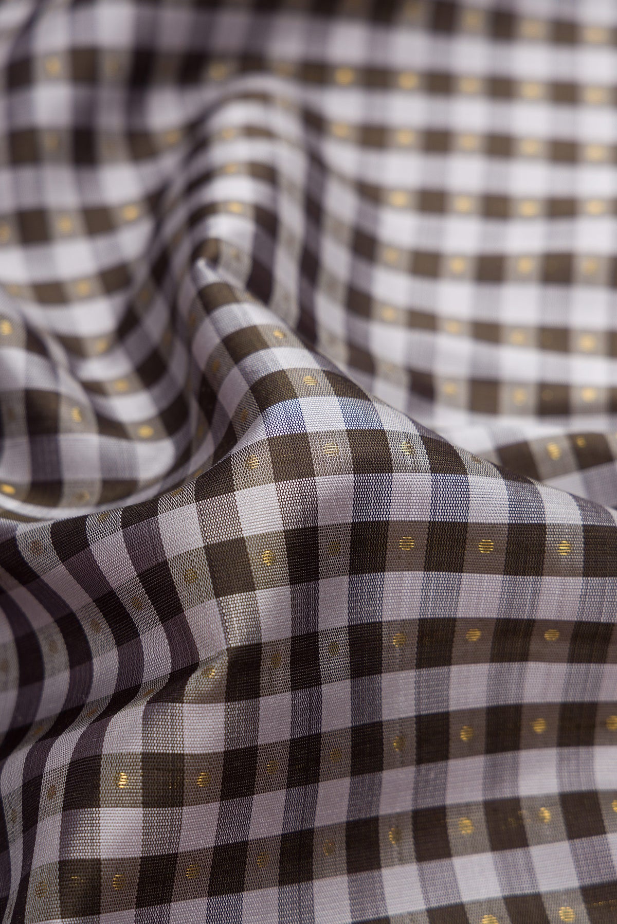 Close up of Pure Silk Pure Zari Black and Grey Color Kanjivaram Saree with Checked design on the body and Zari Border.  displaying folds