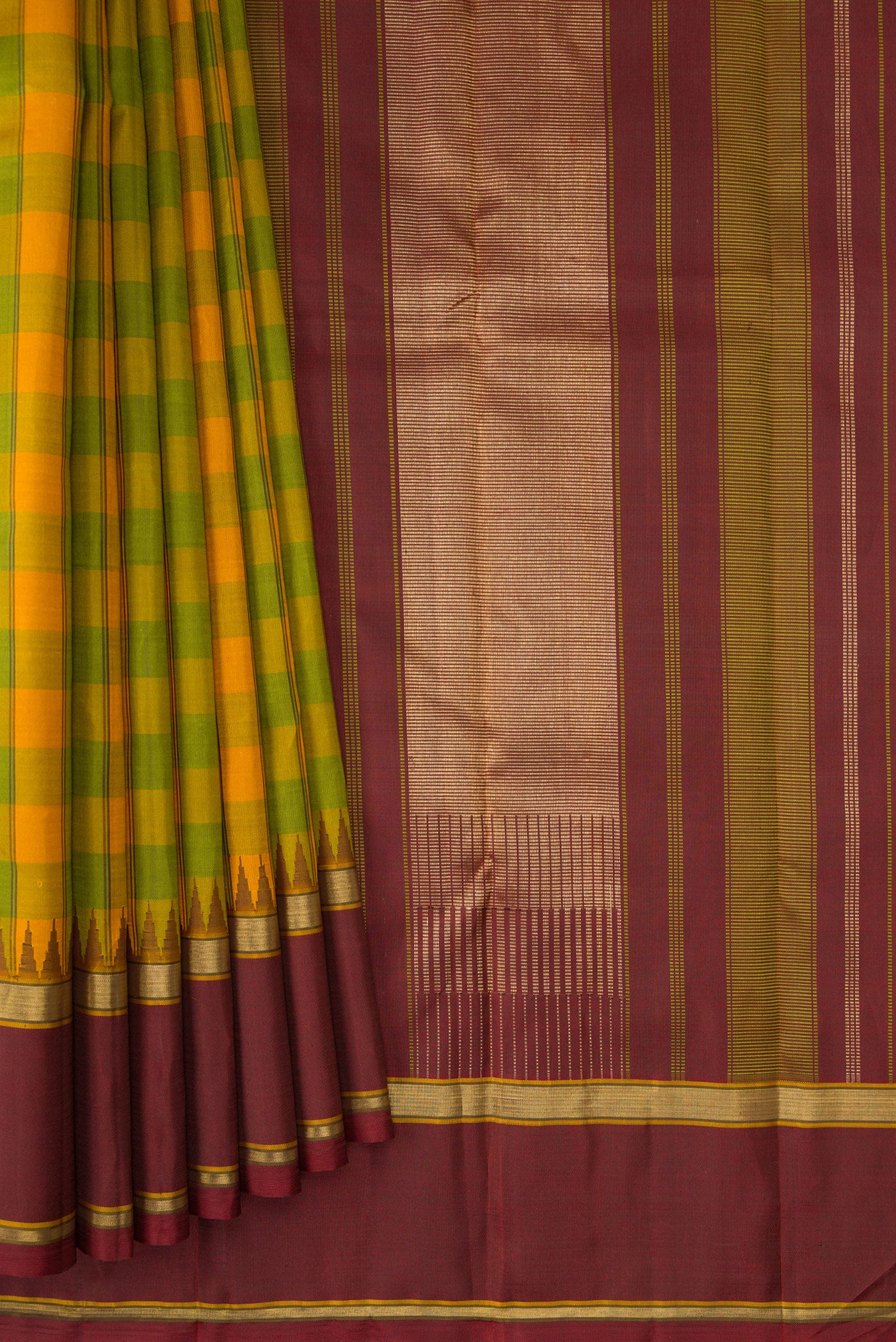 Pleats and pallu of Pure Silk Pure Zari Green and Yellow Color Kanchipuram Saree with Checked design on the body and Temple Border. 