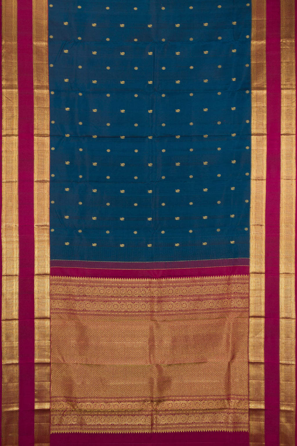 Flat view of Peacock Blue Kanchipuram Silk Saree with Zari Butta on the body and Zari Border. 