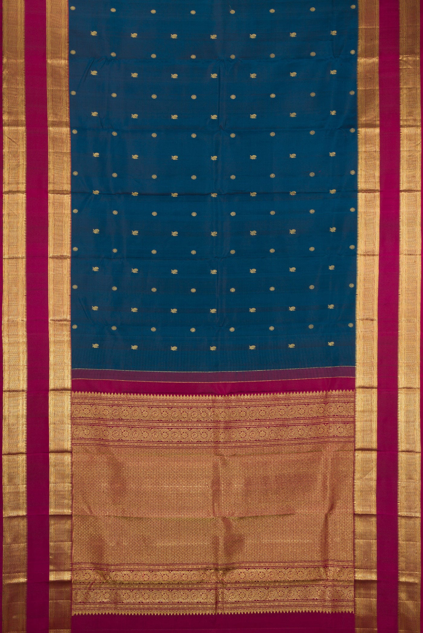 Flat view of Peacock Blue Kanchipuram Silk Saree with Zari Butta on the body and Zari Border. 