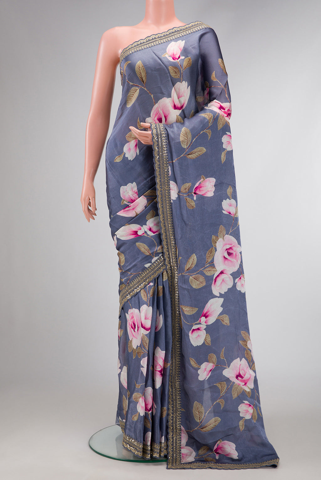 Grey Dual Tone Organza Silk Saree with Printed design on the body and Embroidery Border.  displayed on a mannequin