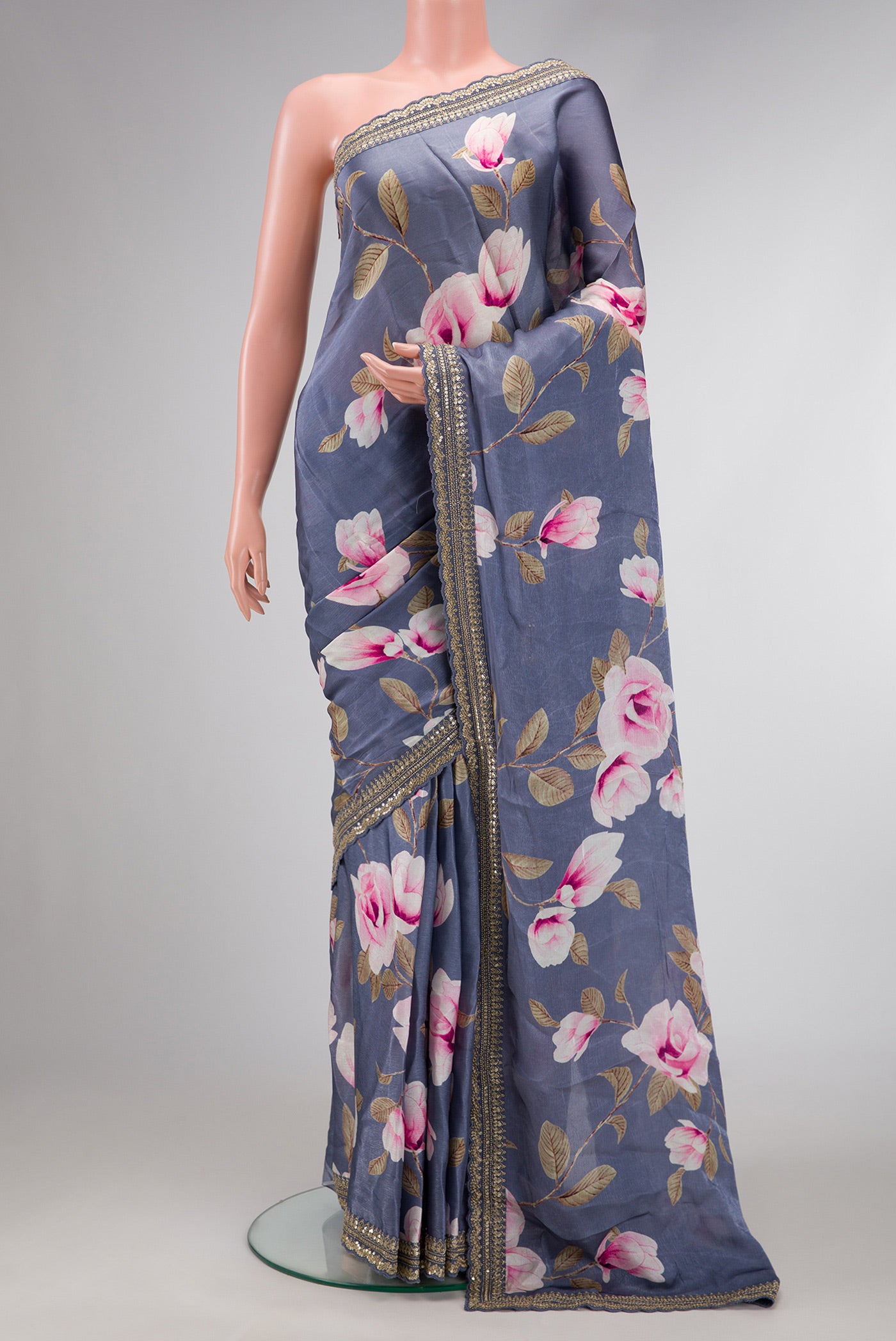 Grey Dual Tone Organza Silk Saree with Printed design on the body and Embroidery Border.  displayed on a mannequin