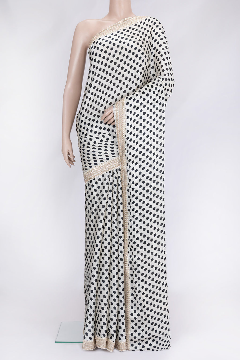 Off White Dual Tone Mysore Crepe Saree with Printed design on the body and Embroidery Border.  displayed on a mannequin
