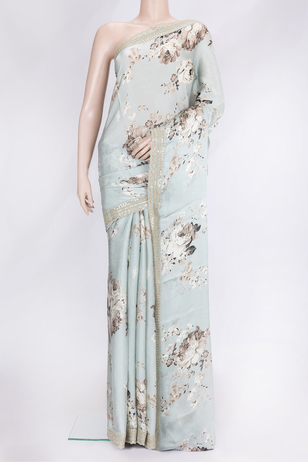 Light Green Dual Tone Mysore Crepe Saree with Printed design on the body and Embroidery Border.  displayed on a mannequin