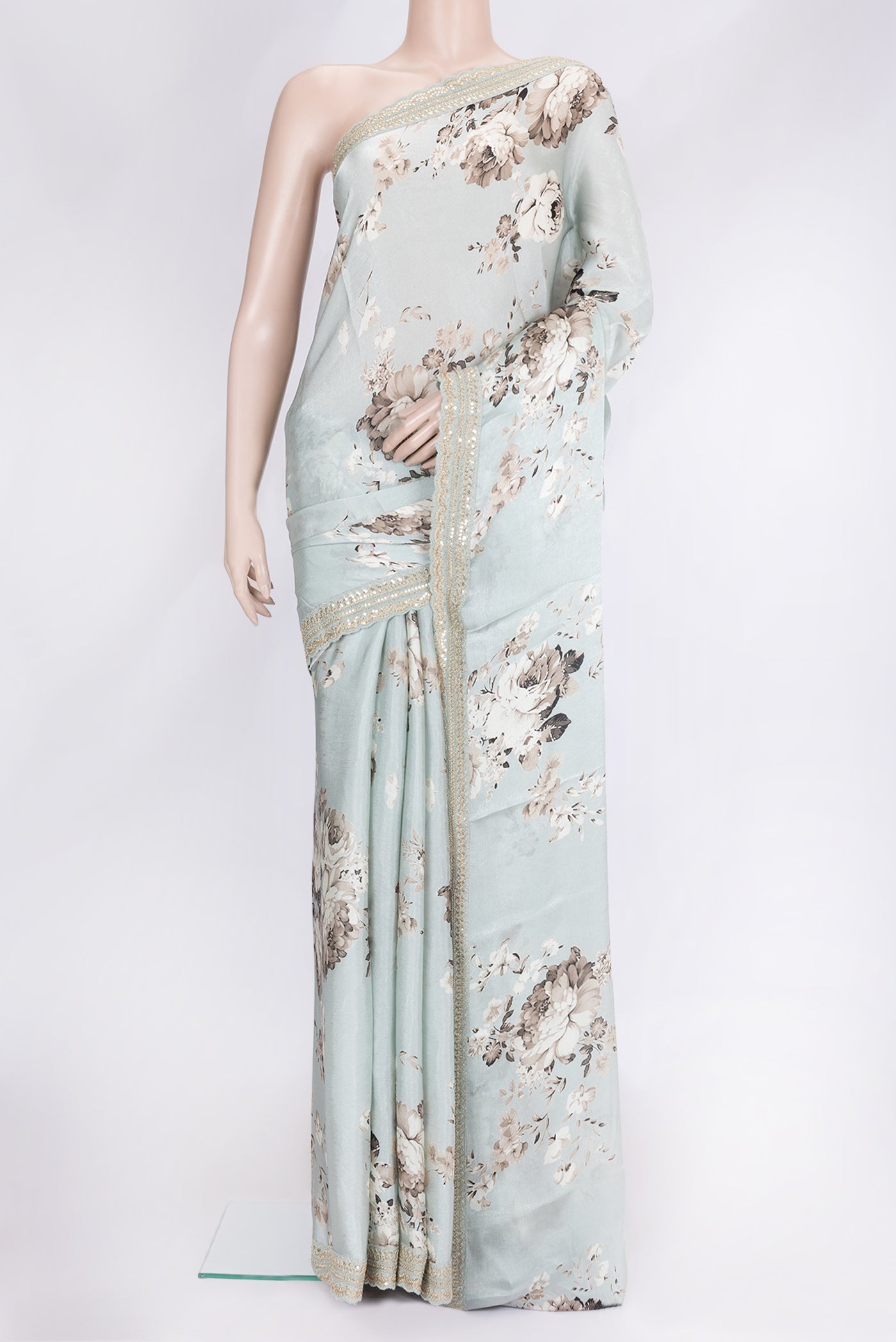 Light Green Dual Tone Mysore Crepe Saree with Printed design on the body and Embroidery Border.  displayed on a mannequin